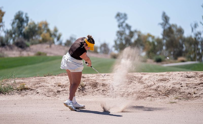 Kiley Reisner hits out of the sand at the Cowgirl Classic