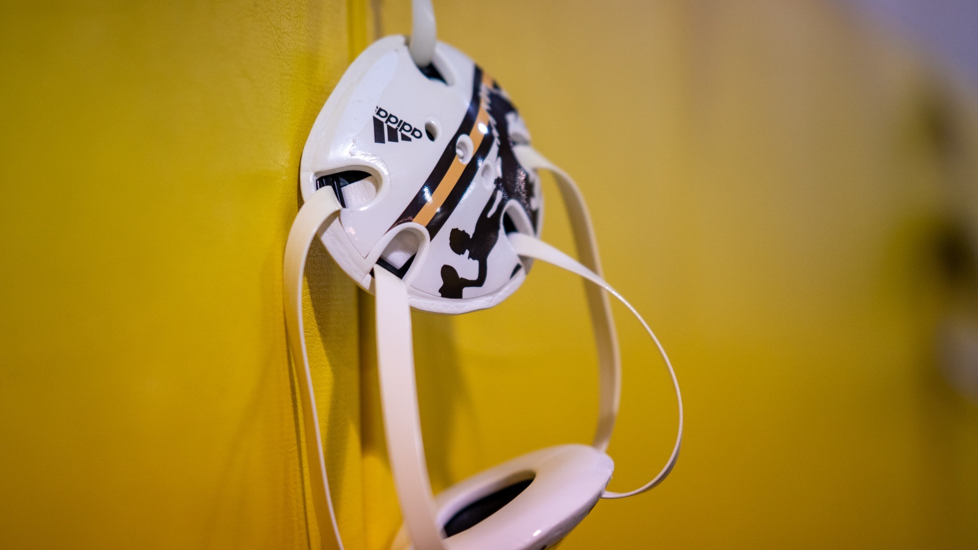 Wrestling headgear hangs in the practice facility