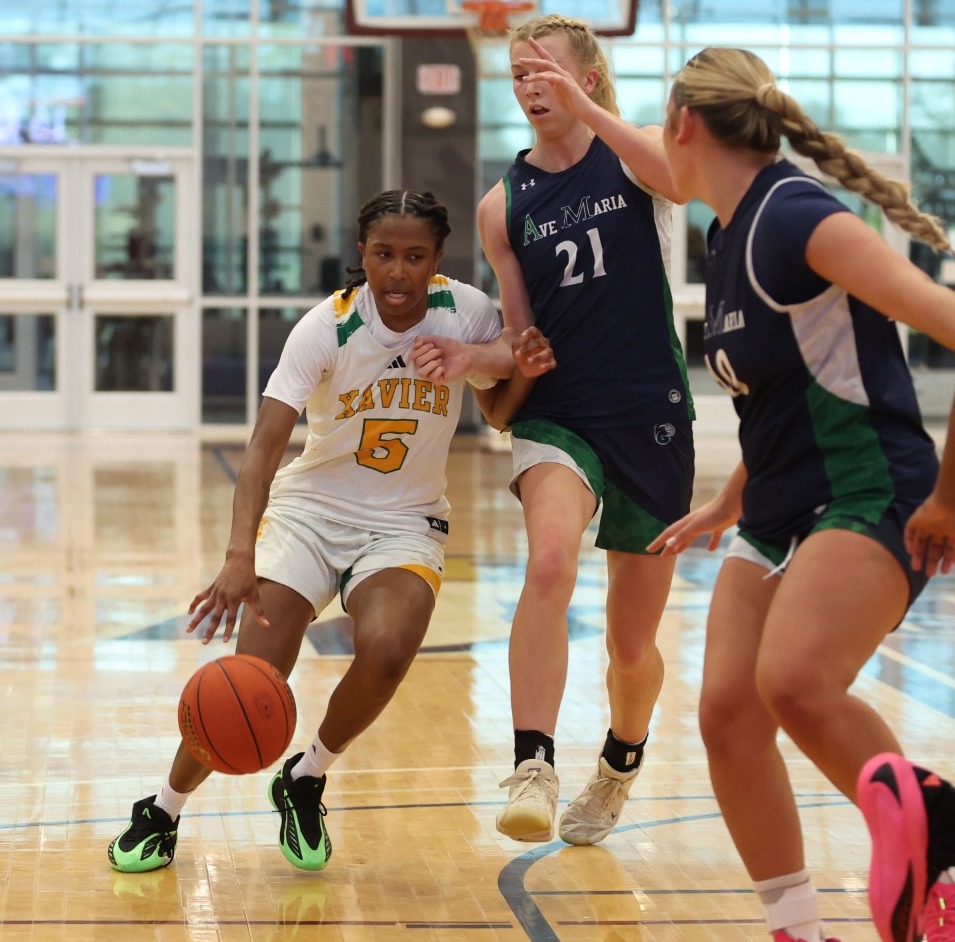 Jakayla Gilmer drives the lane in Eagle Classic
