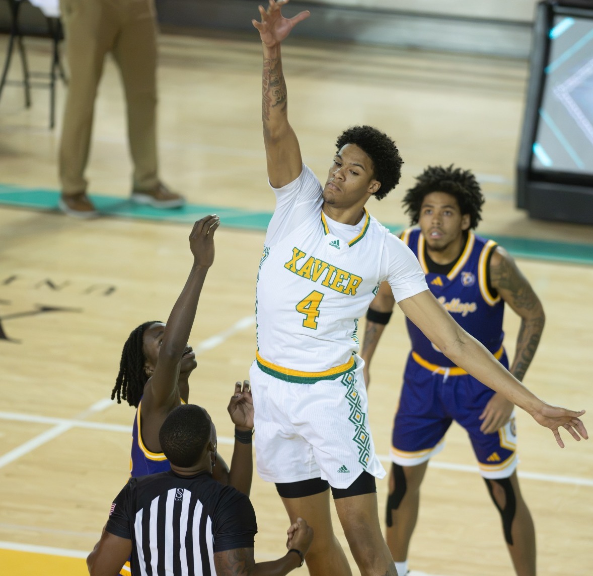 Jylan Howze wins the jumpball versus Texas College