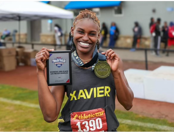 Rochelle Jeffries shows off her bronze medal and All-America plaque. 