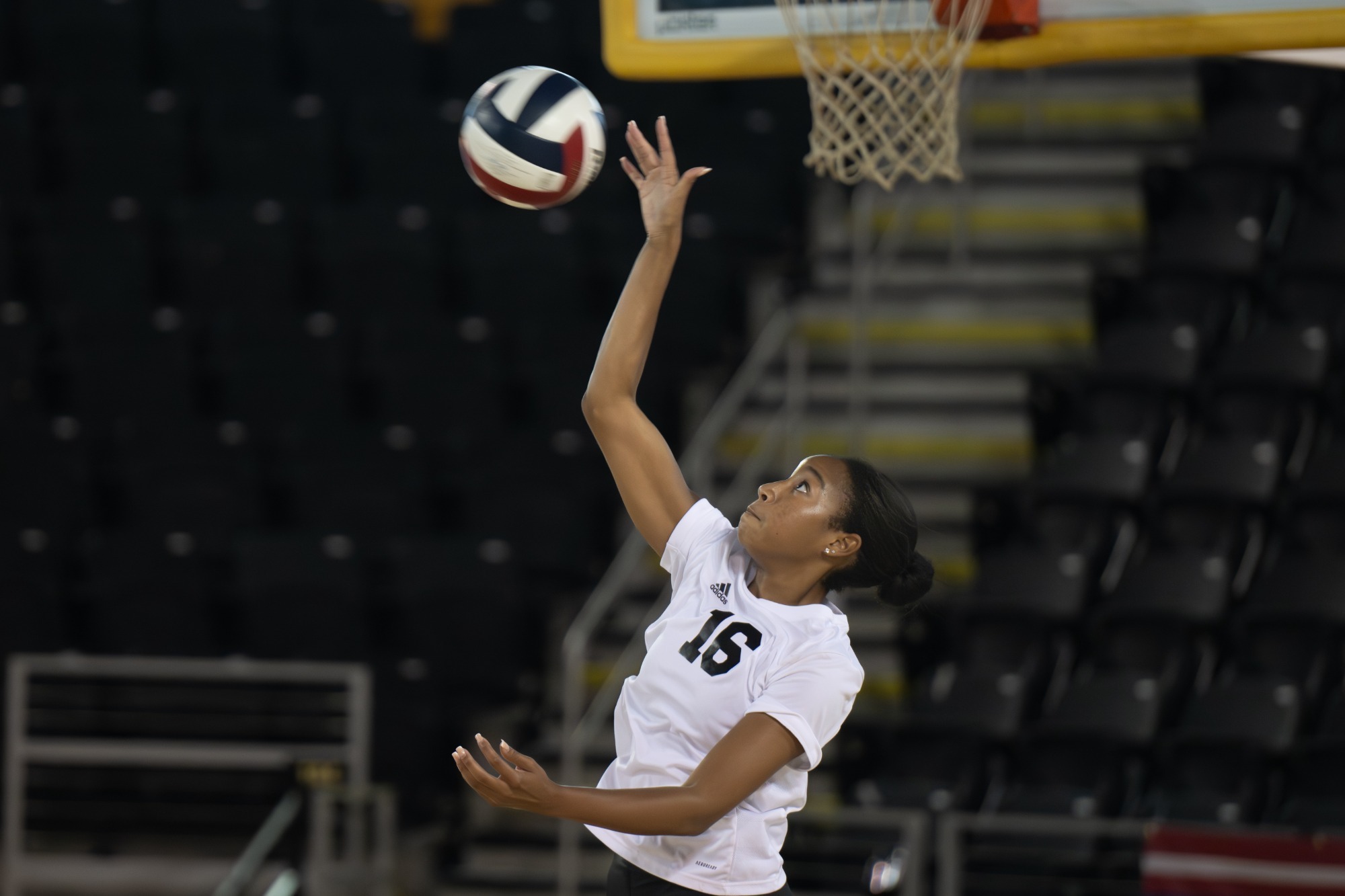 Charlie Henderson serves versus Loyola