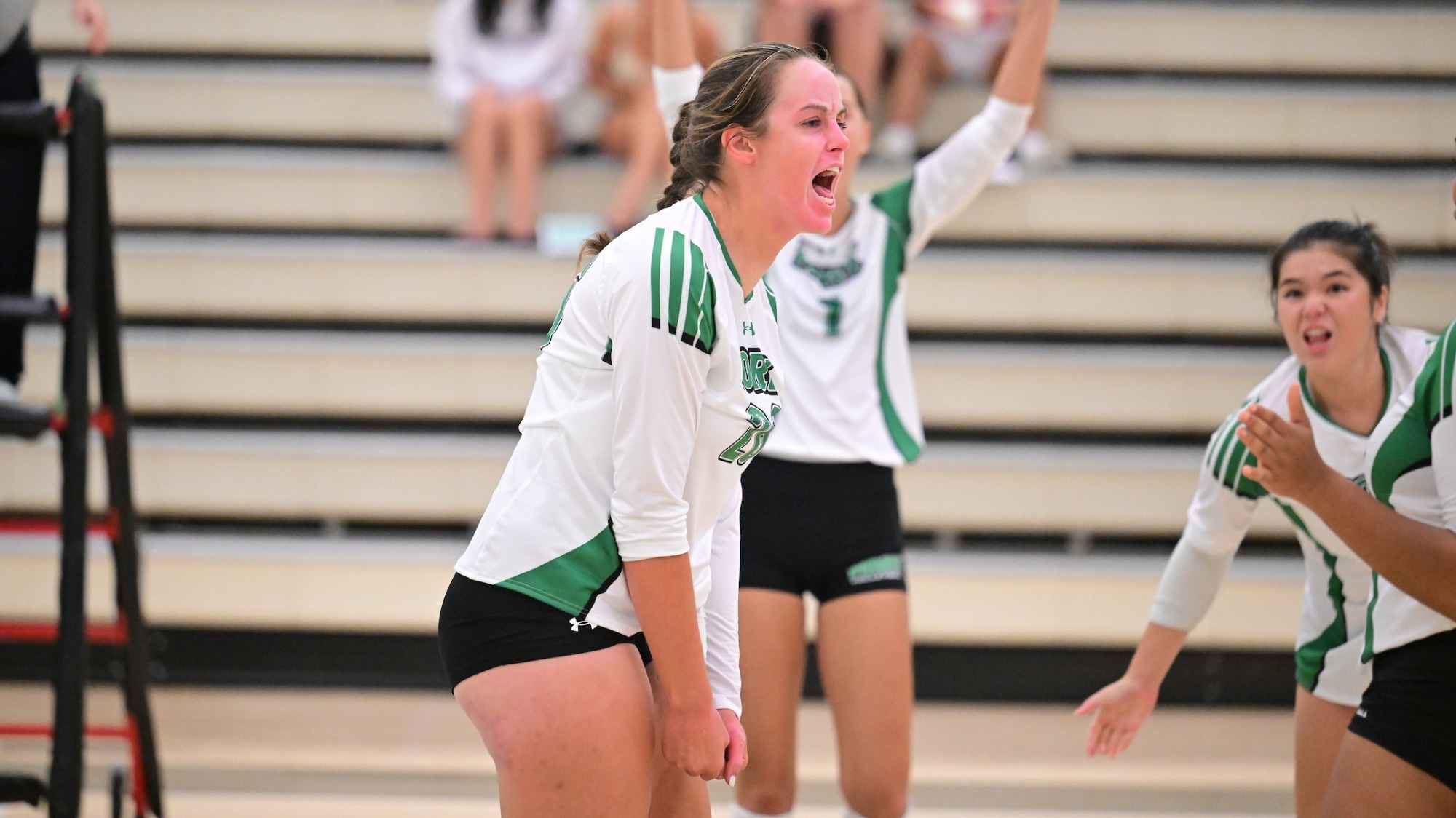 female volleyball player celebrates