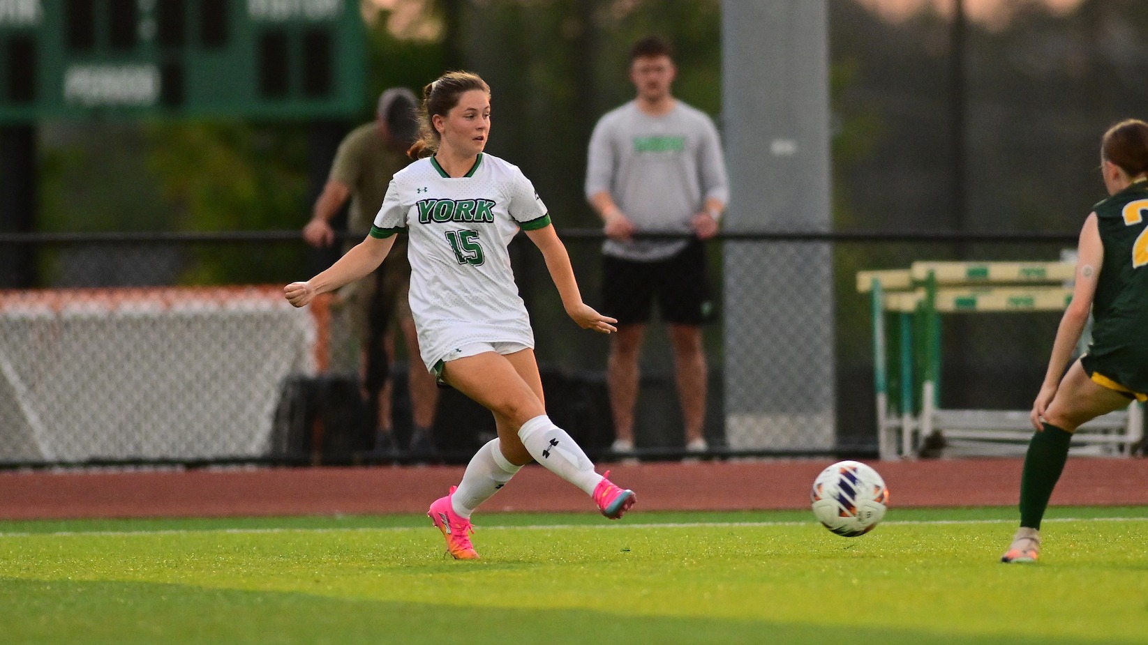 female soccer player shoots on goal