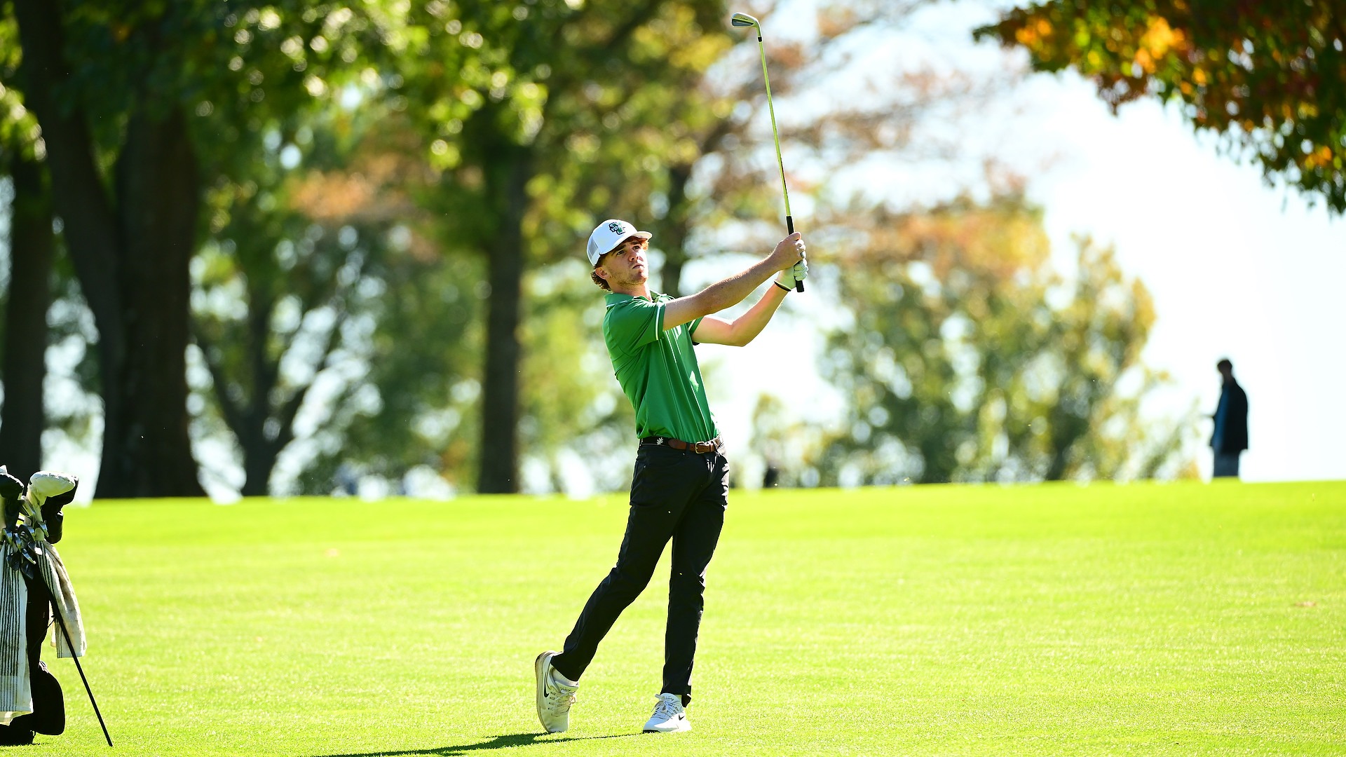 male golfer hold followthrough