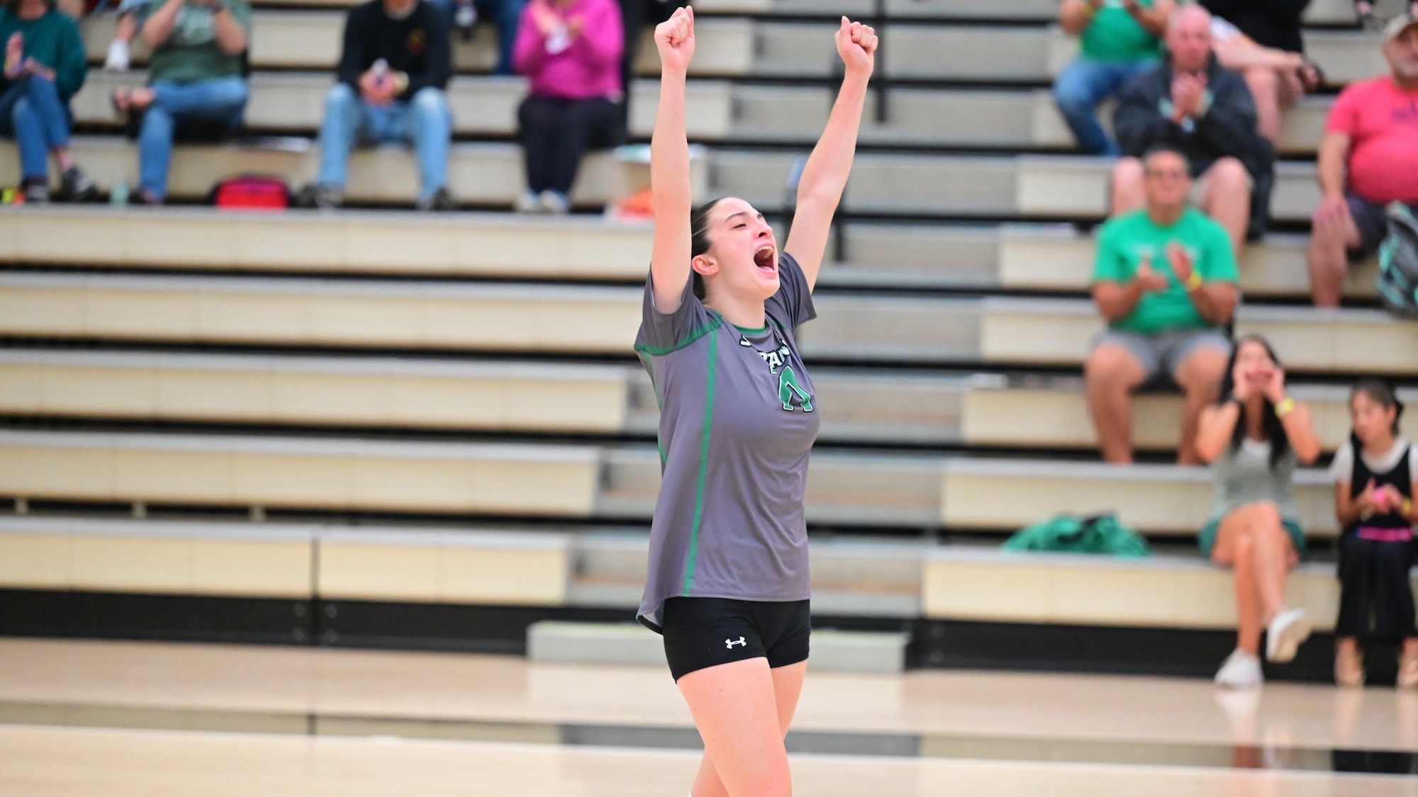 female volleyball celebrates