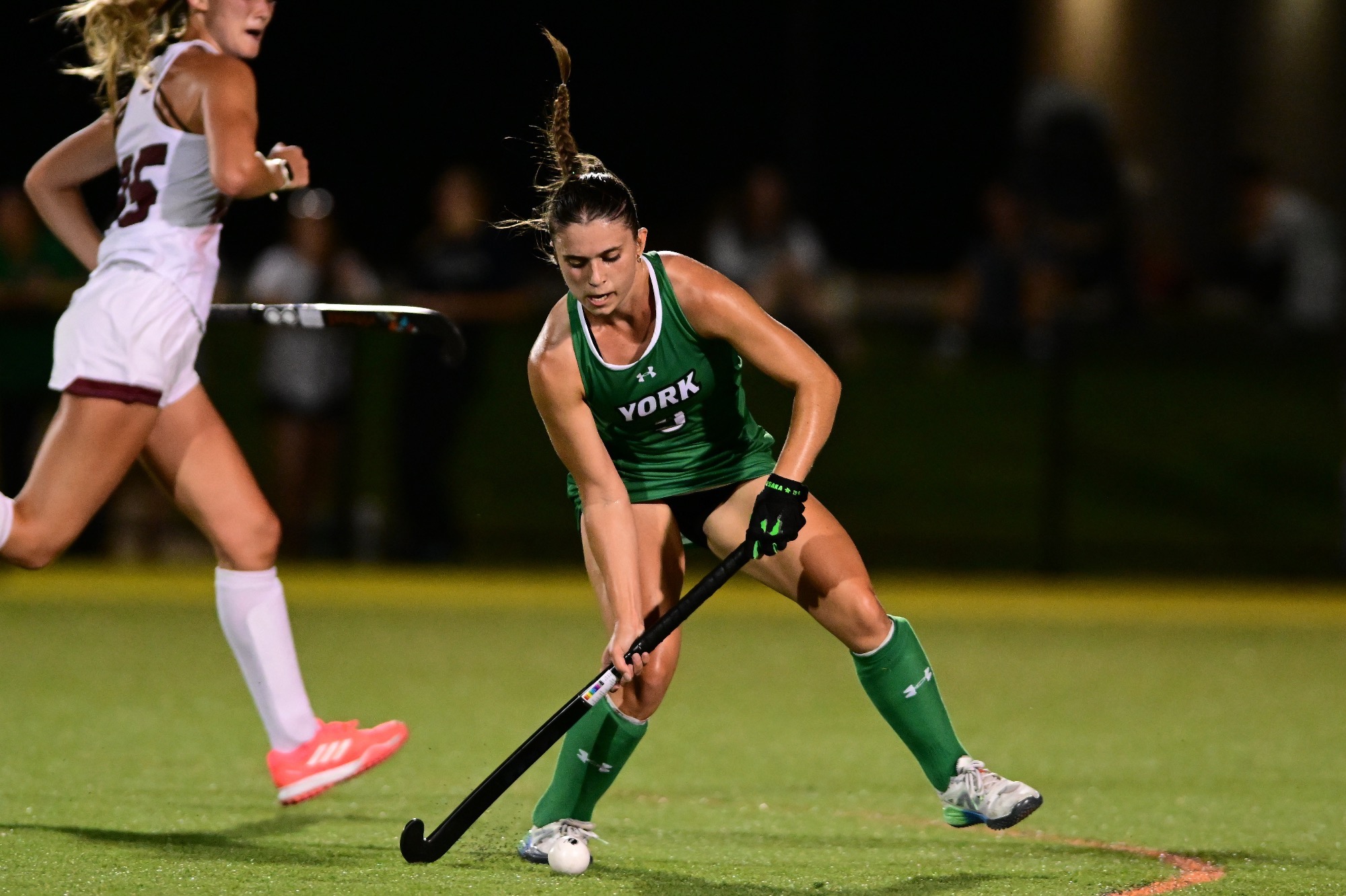 Female holding field hockey stick