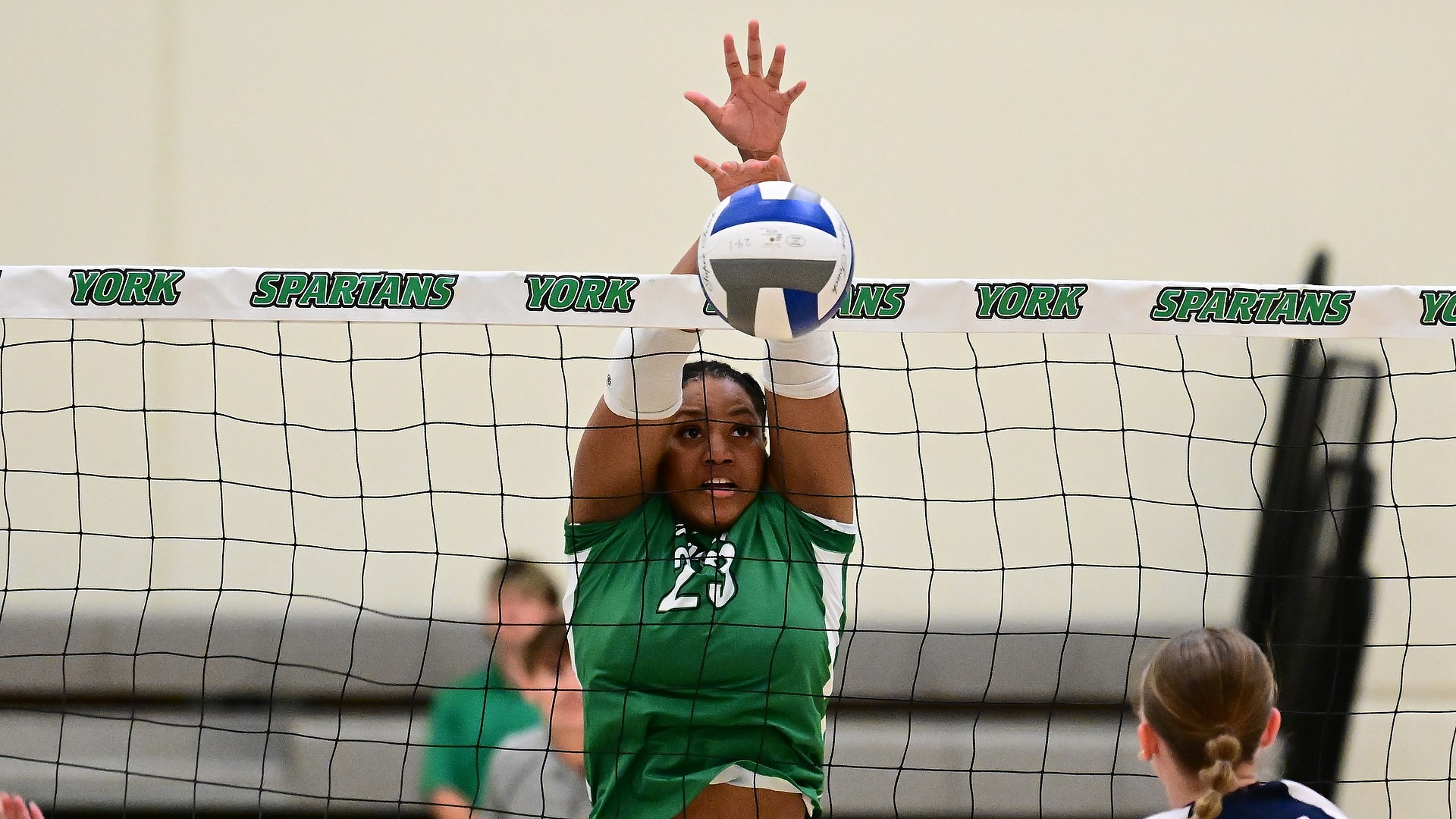 female volleyball player blocks