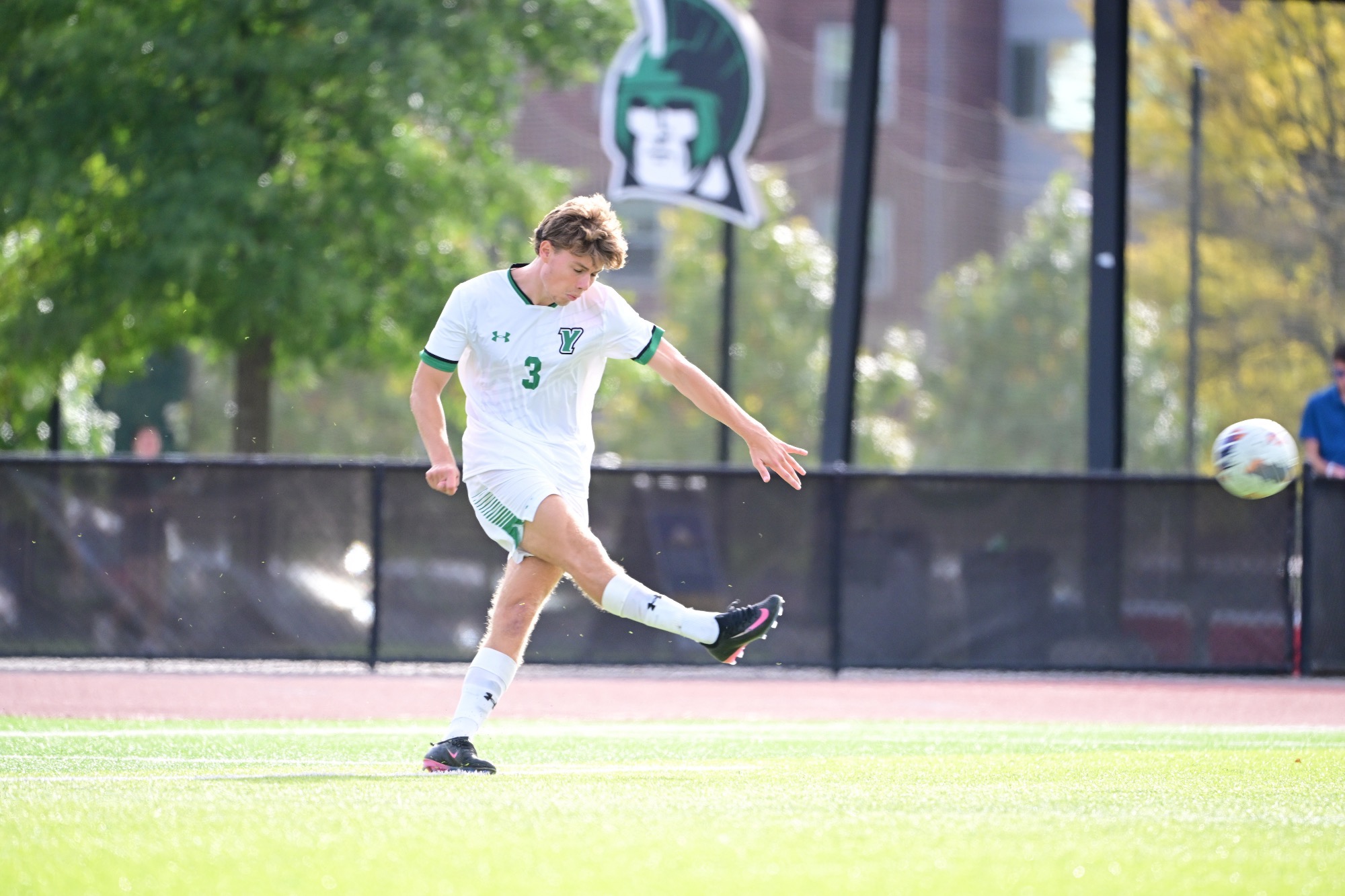 Male kicking soccer ball