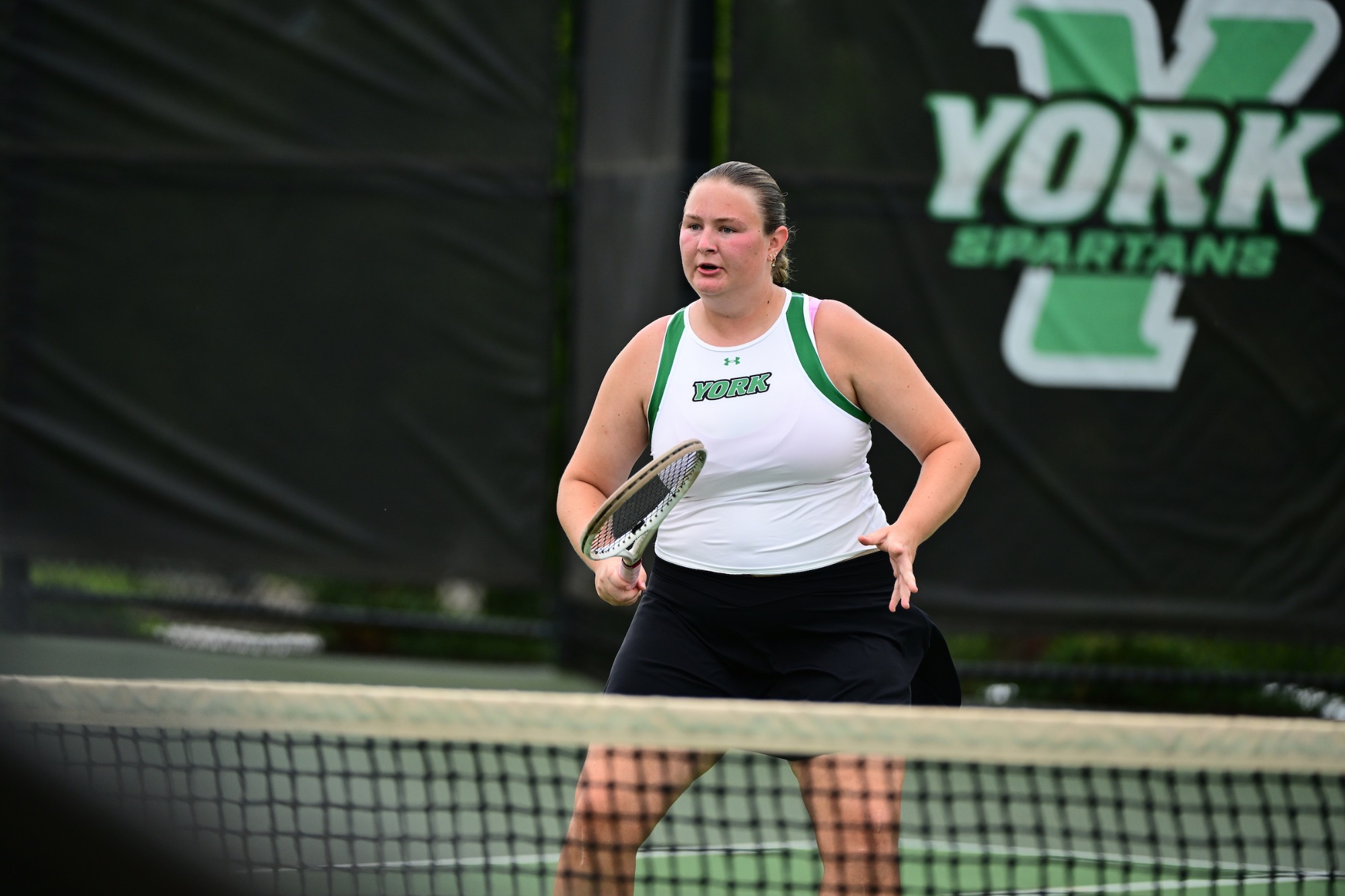 Female holding tennis racket