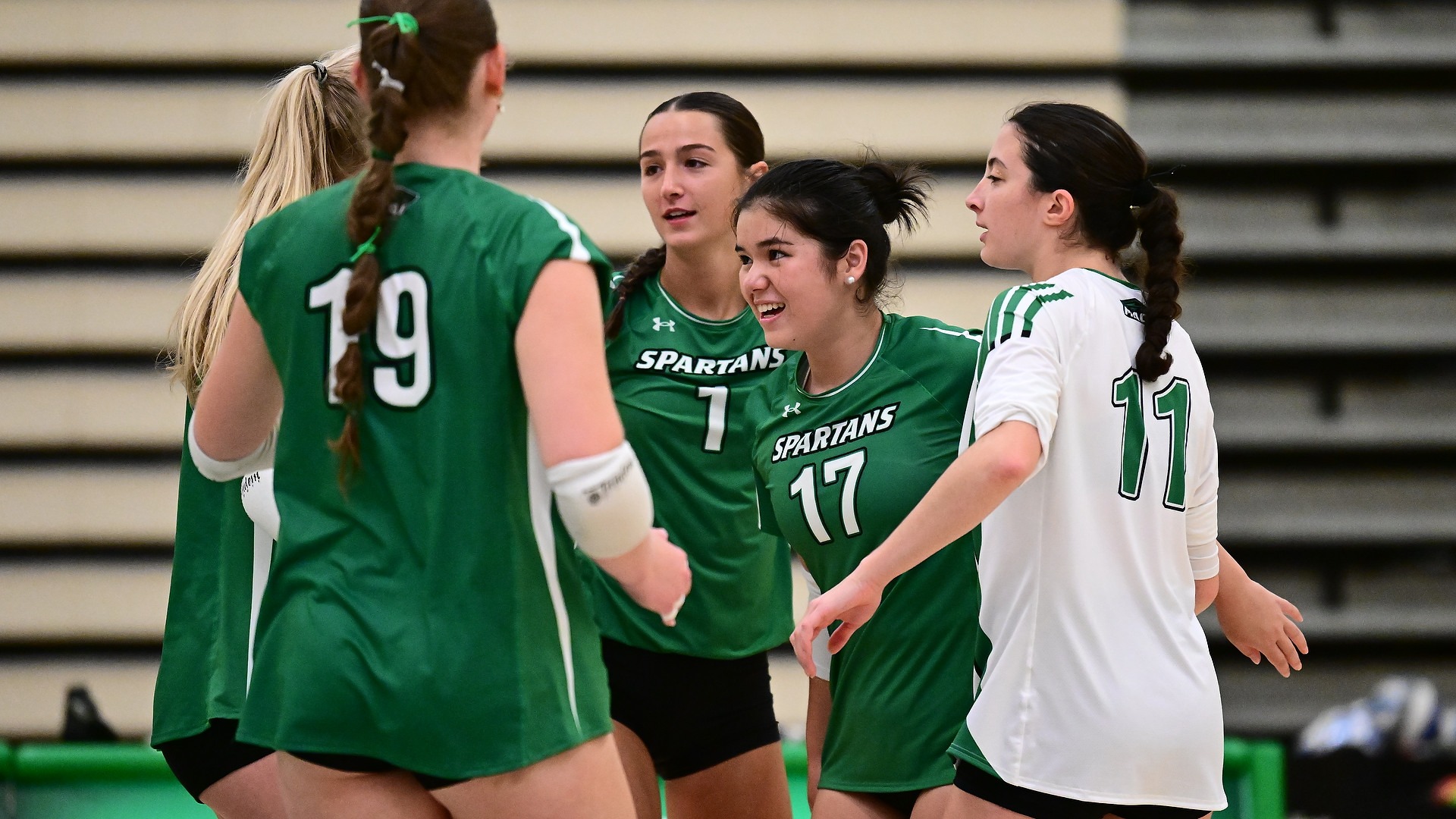 female volleyball team celebrates