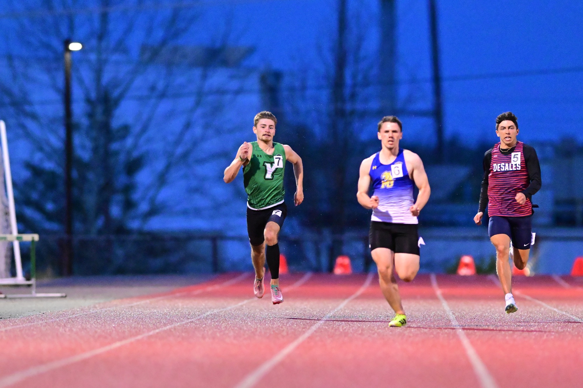 Male in green uniform running
