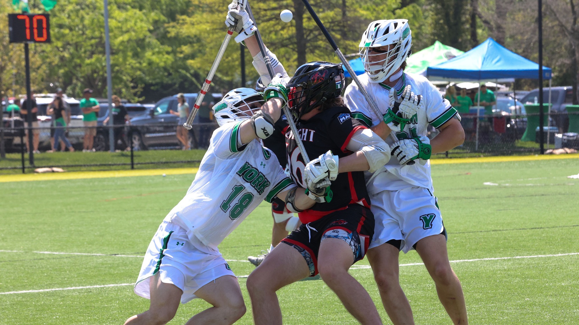 male lacrosse players from York defend Albright player