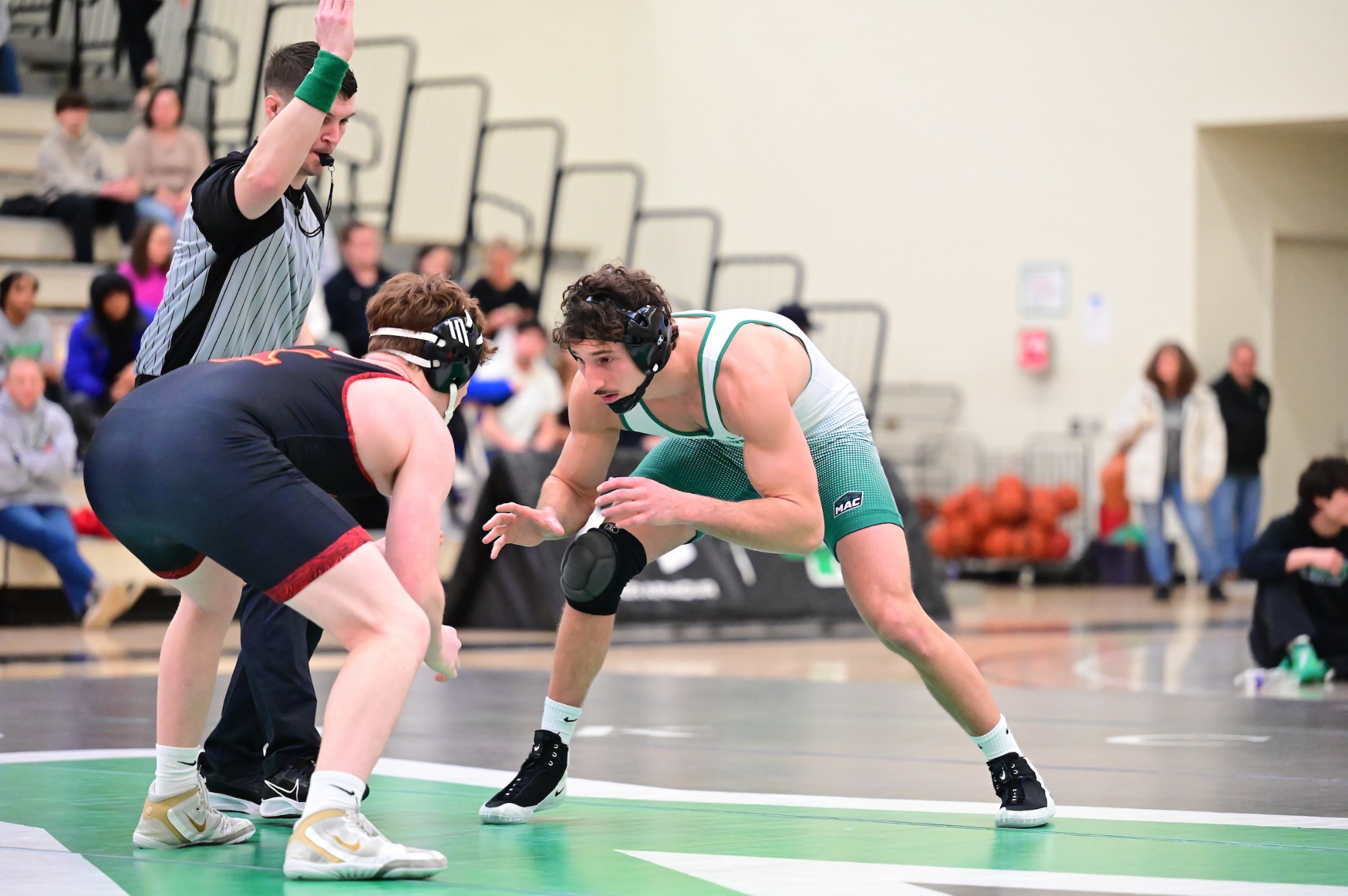 wrestler in ready position on mat