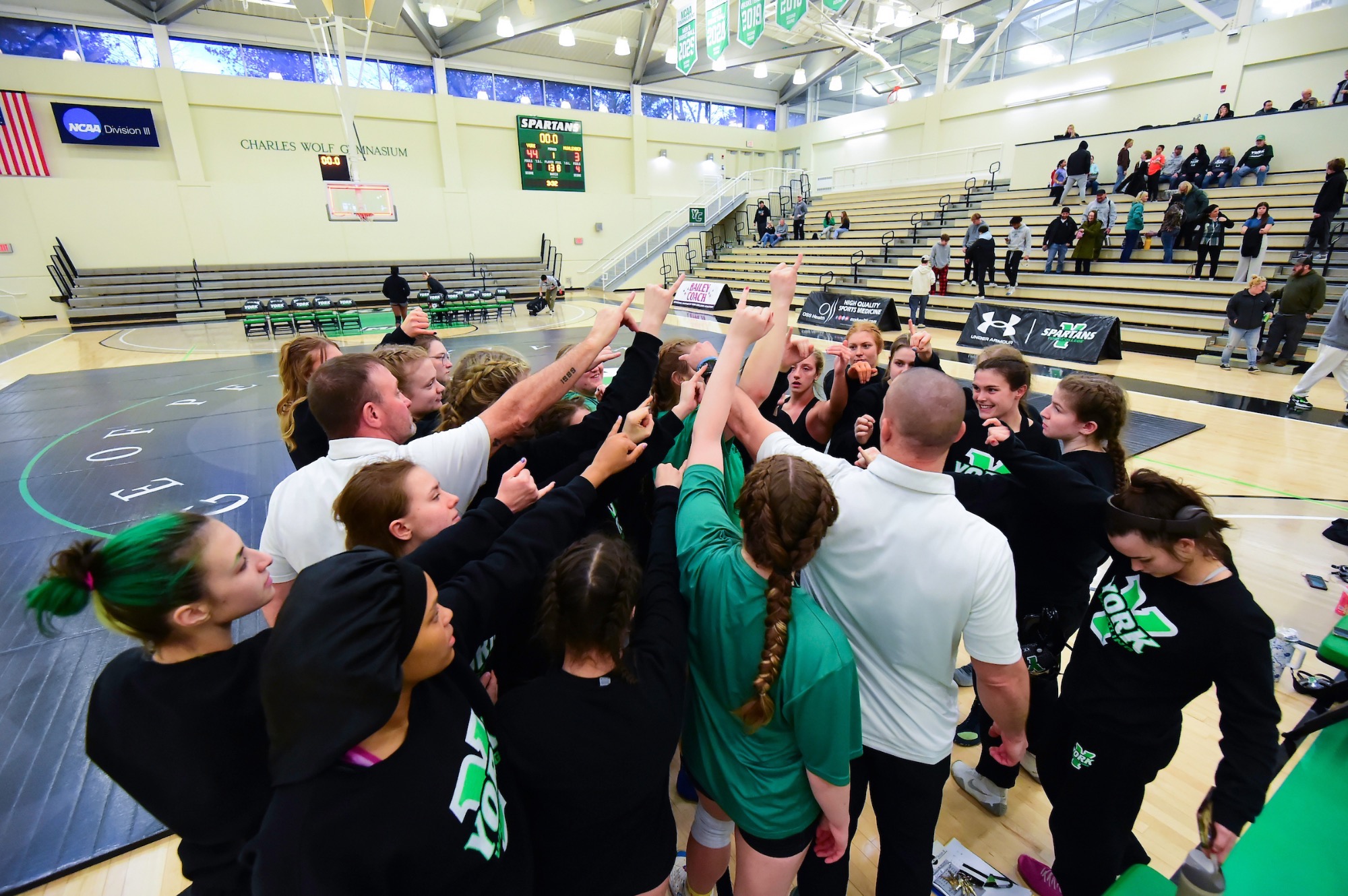 Wrestling team in huddle