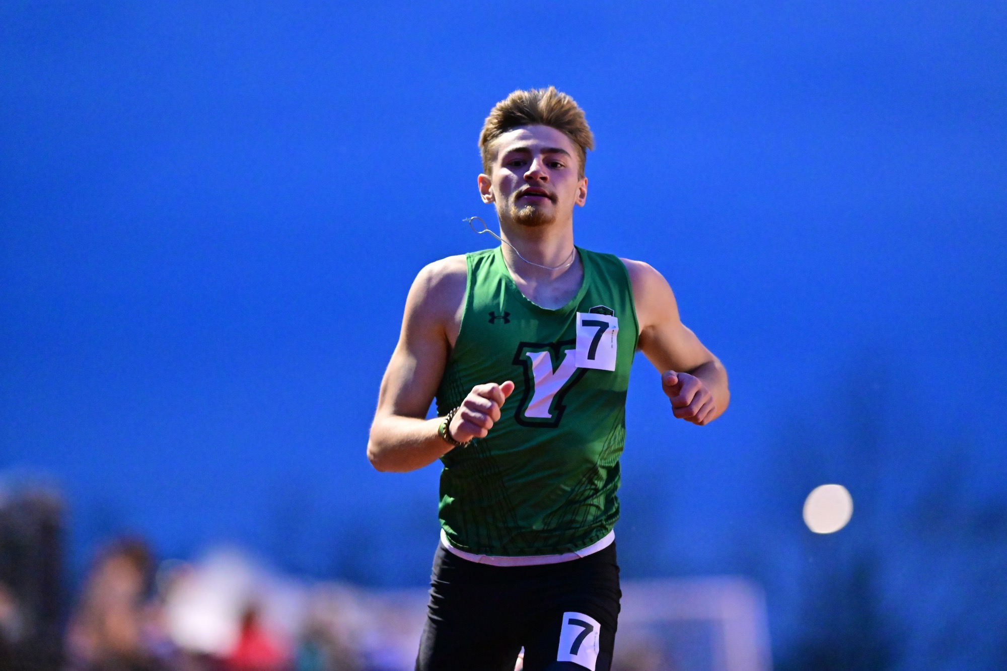 Male in green running