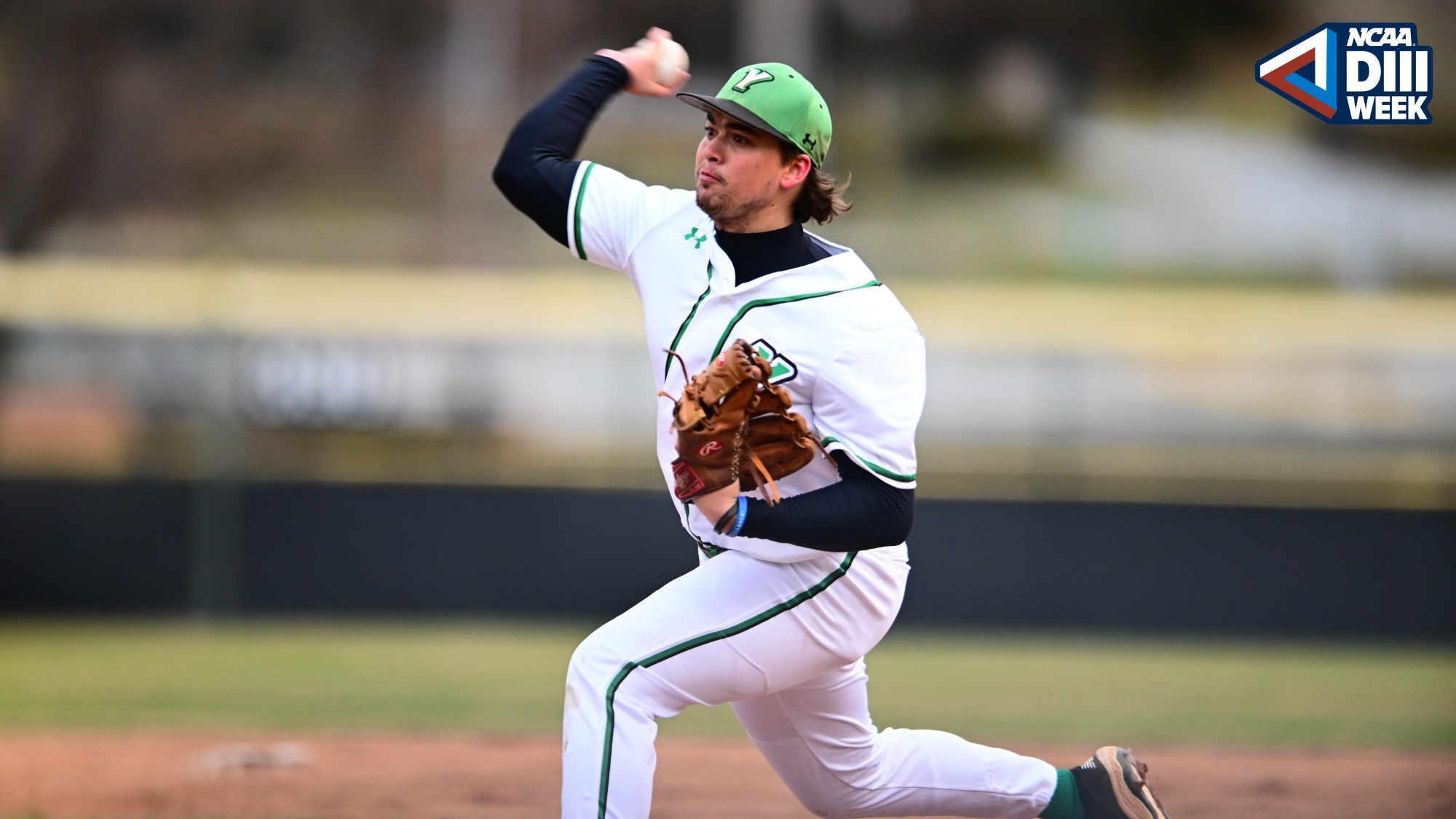 male baseball pitcher throws ball