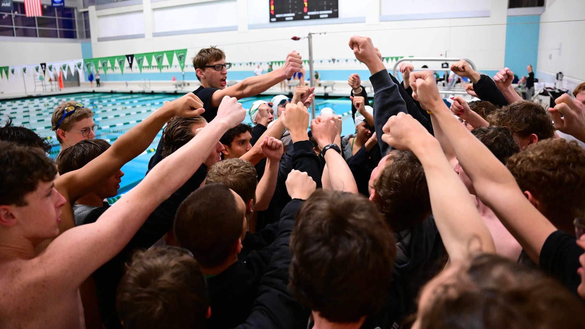 members of swimming team in a huddle