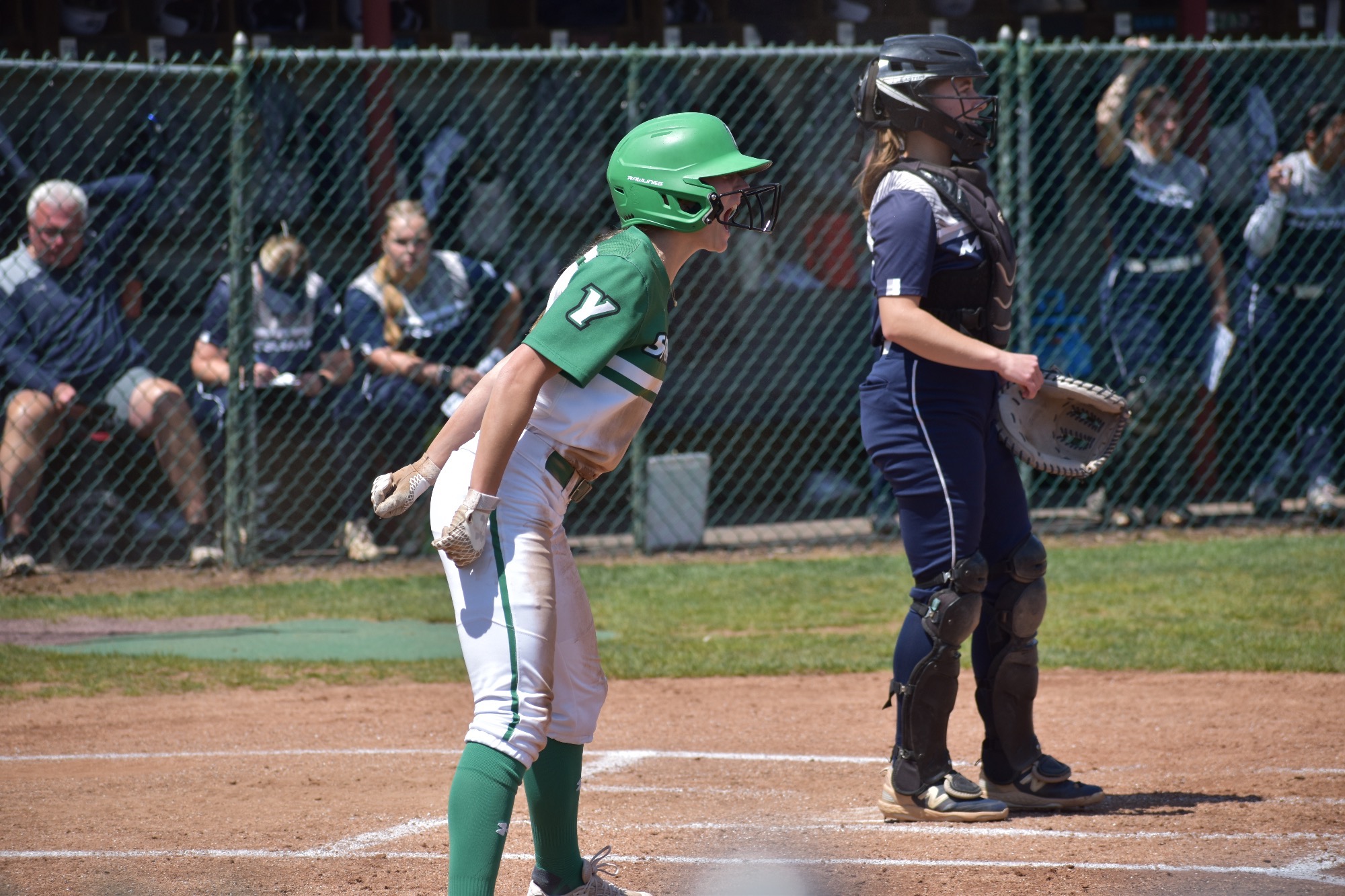 Female in white uniform yelling