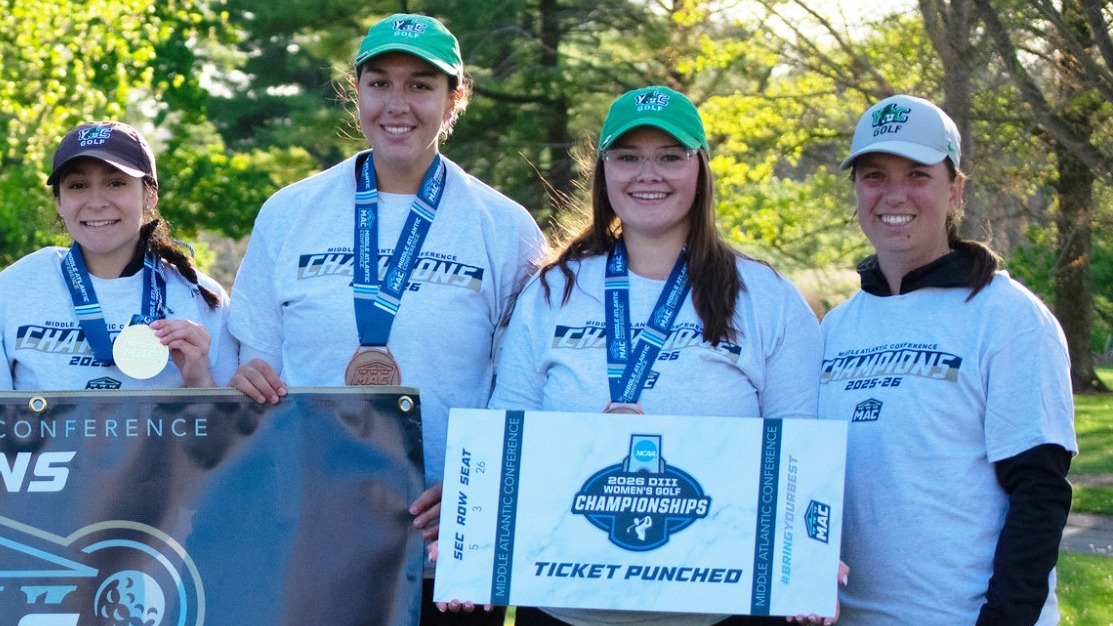 members of the women's golf team pose with NCAA banner