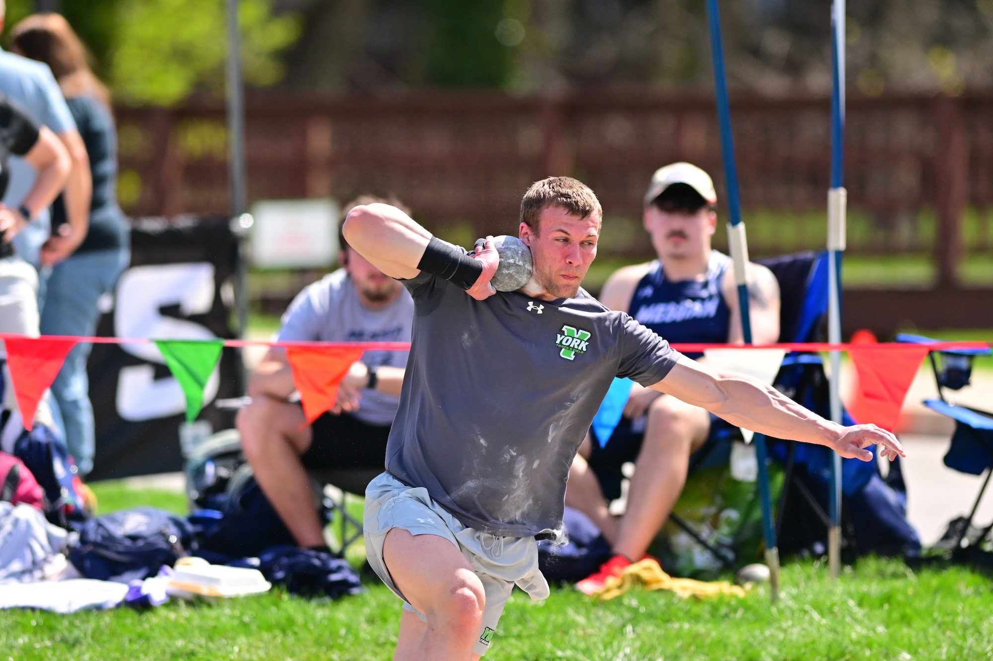 male throwing shot put