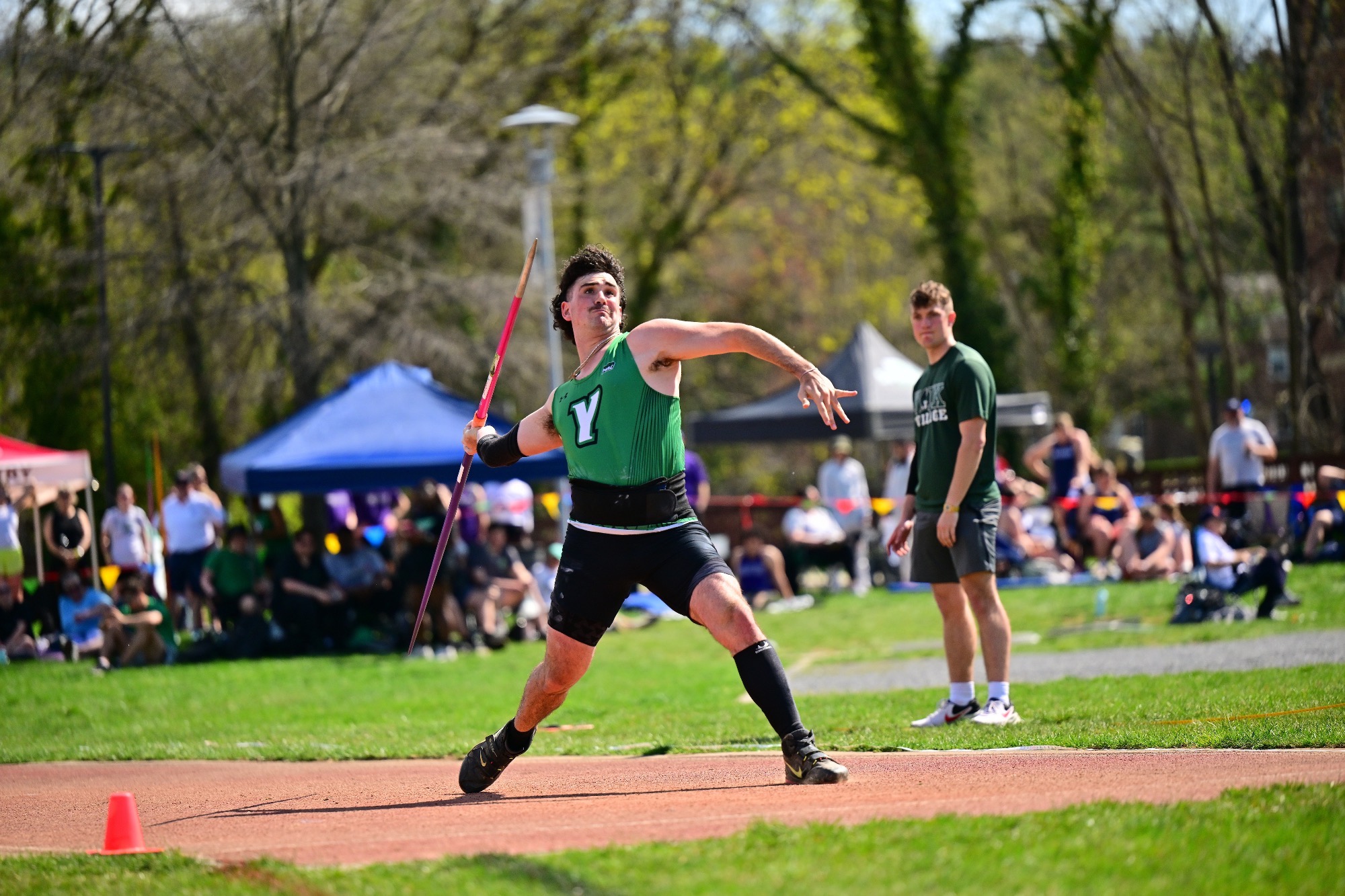 male throwing javelin
