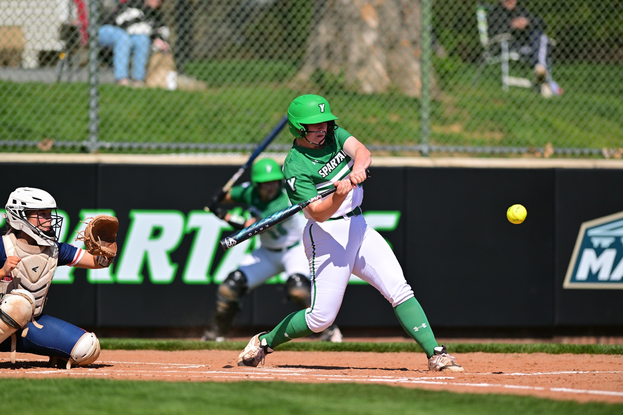 female swinging softball bat