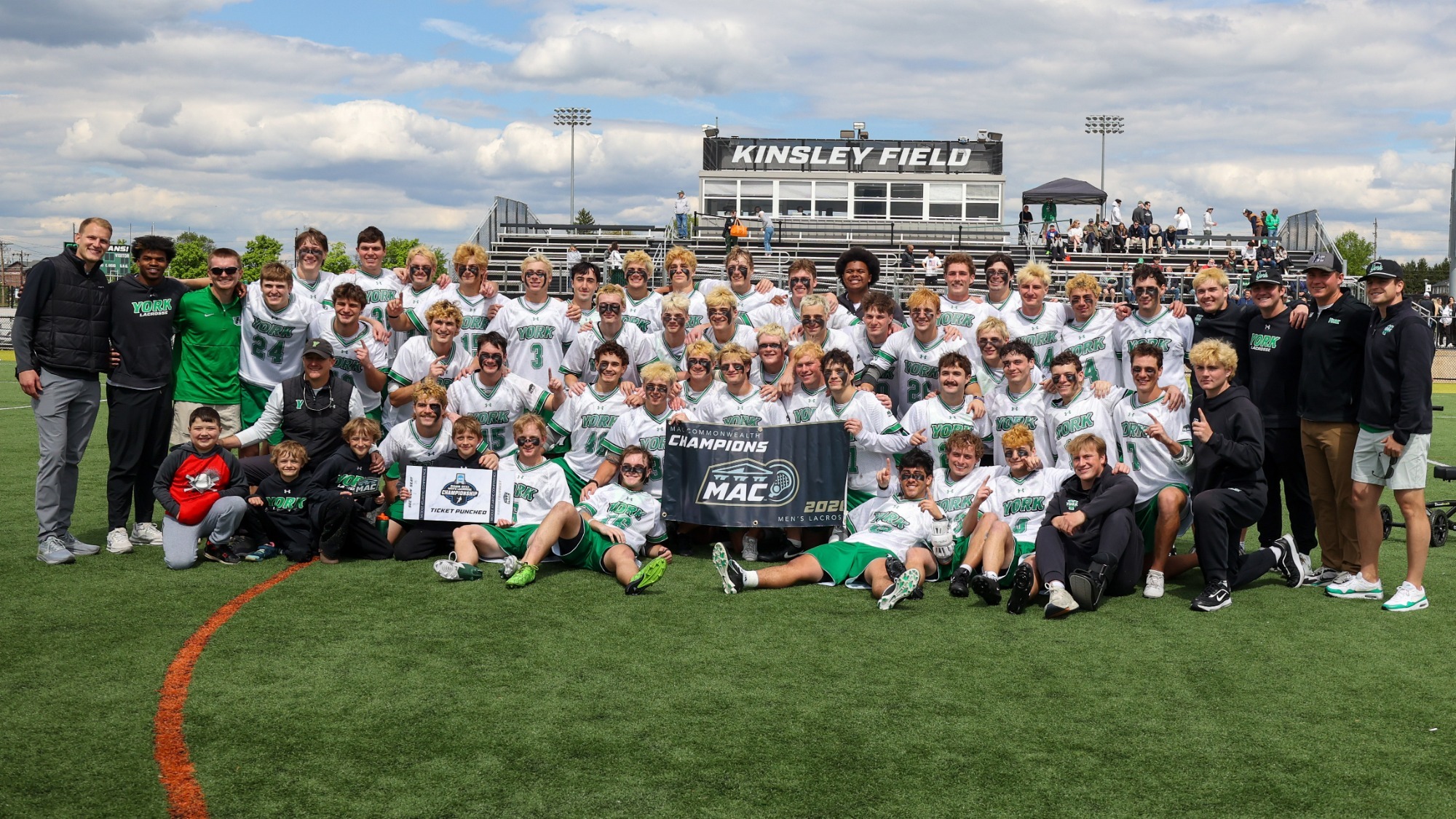 men's lacrosse team poses for team championship photo