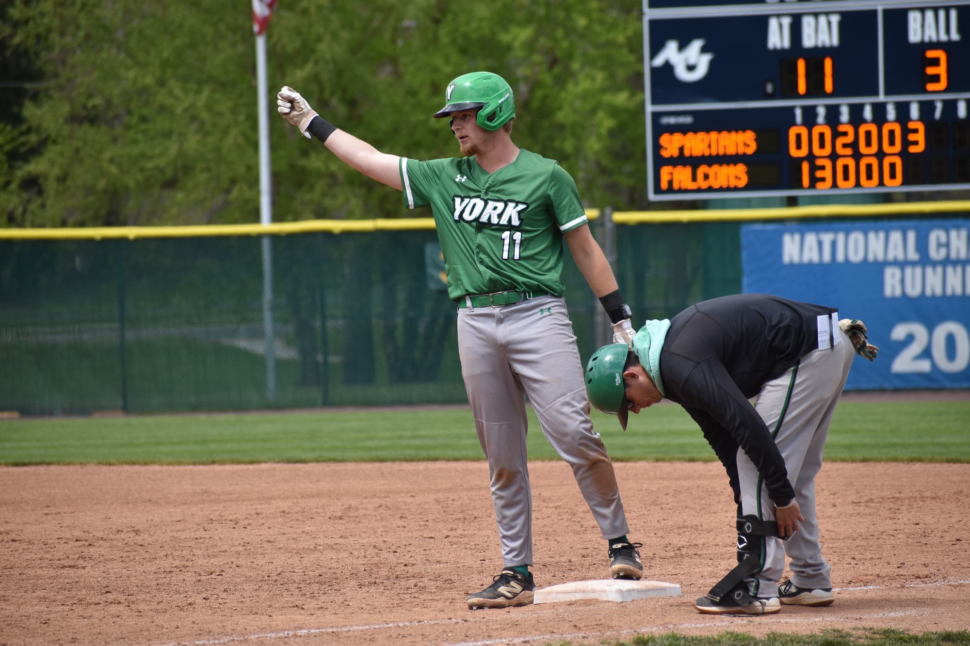 Male standing on baseball base