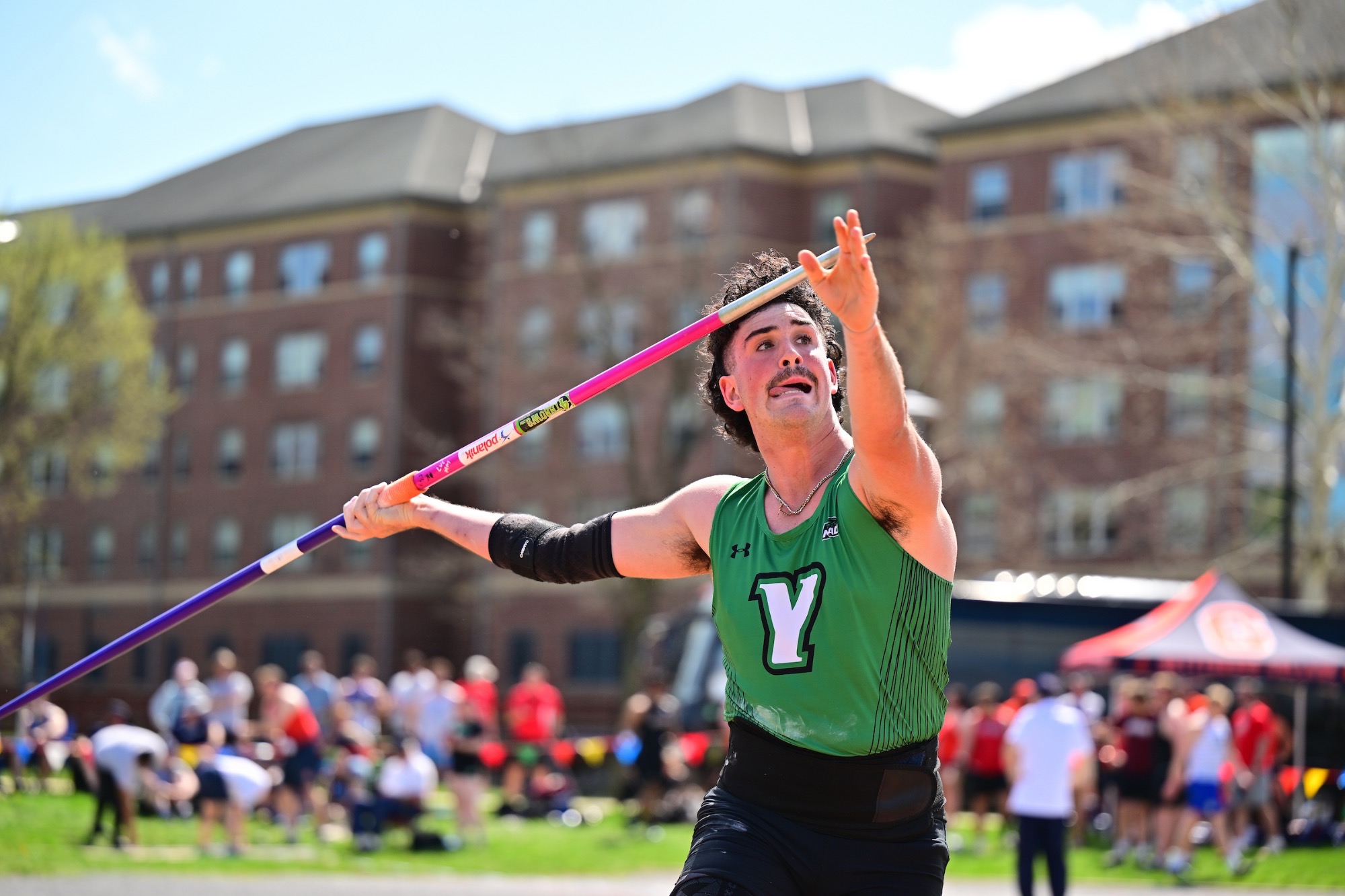 male throwing javelin