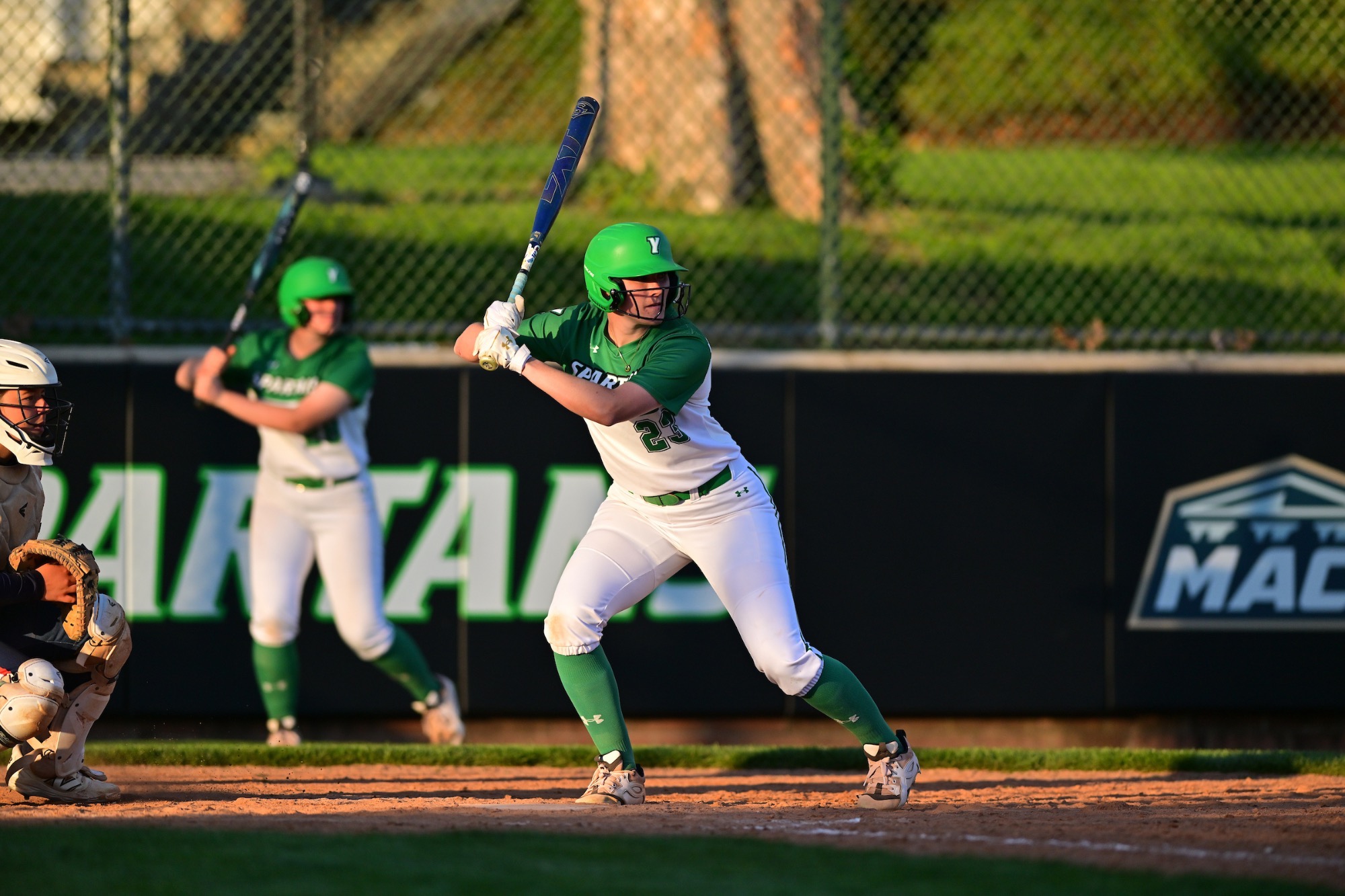 Female swinging softball bat