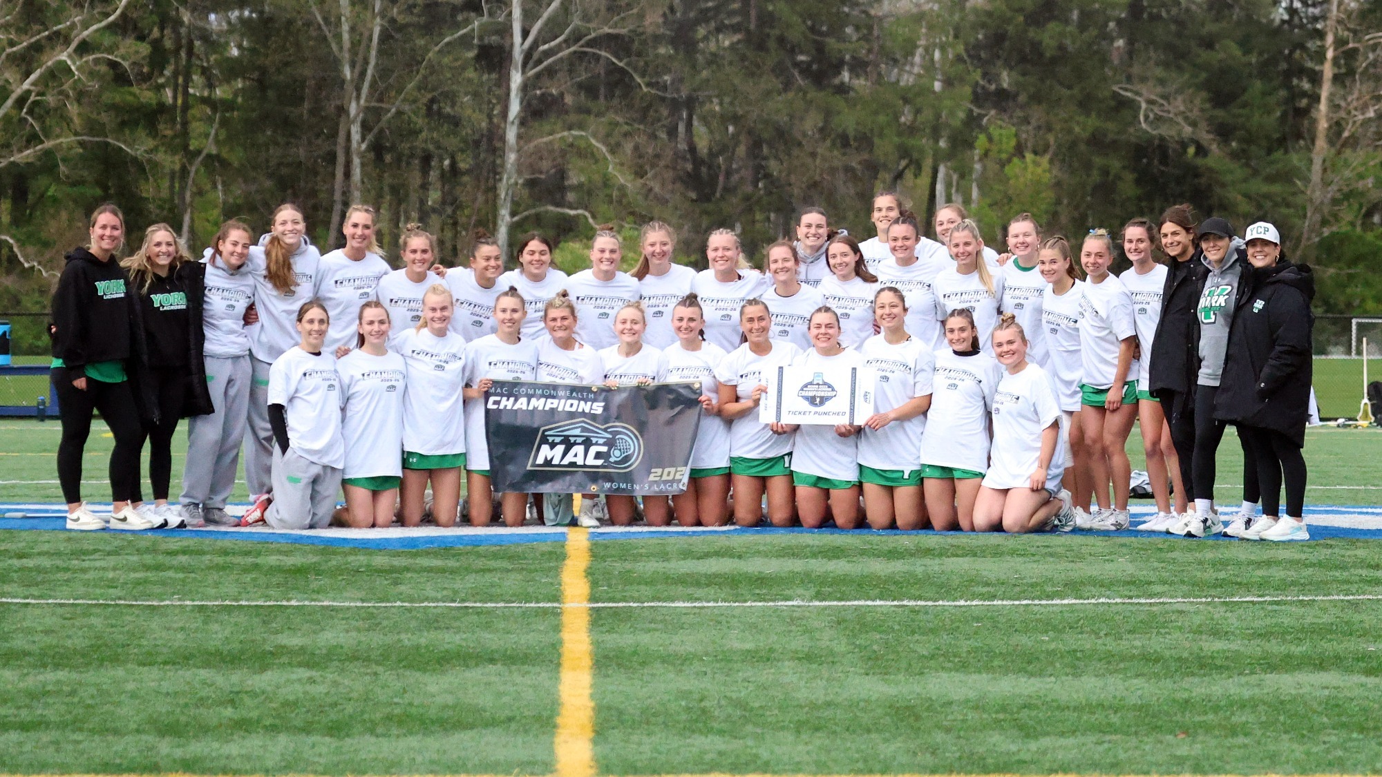women's lacrosse team poses conference championship photo