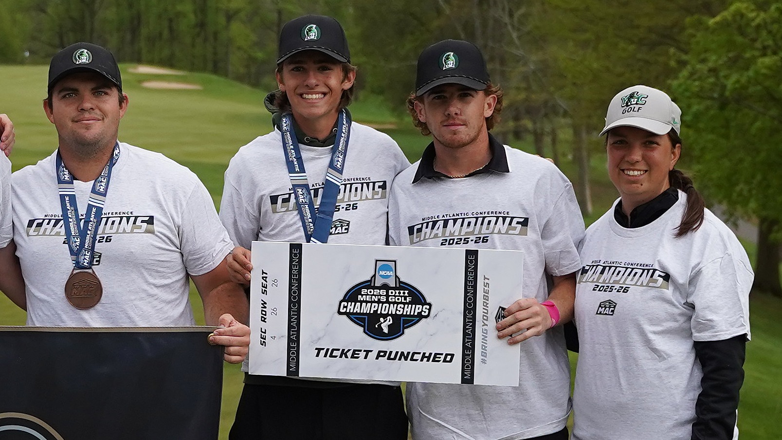 members of men's golf team pose with ncaa qualifier sign