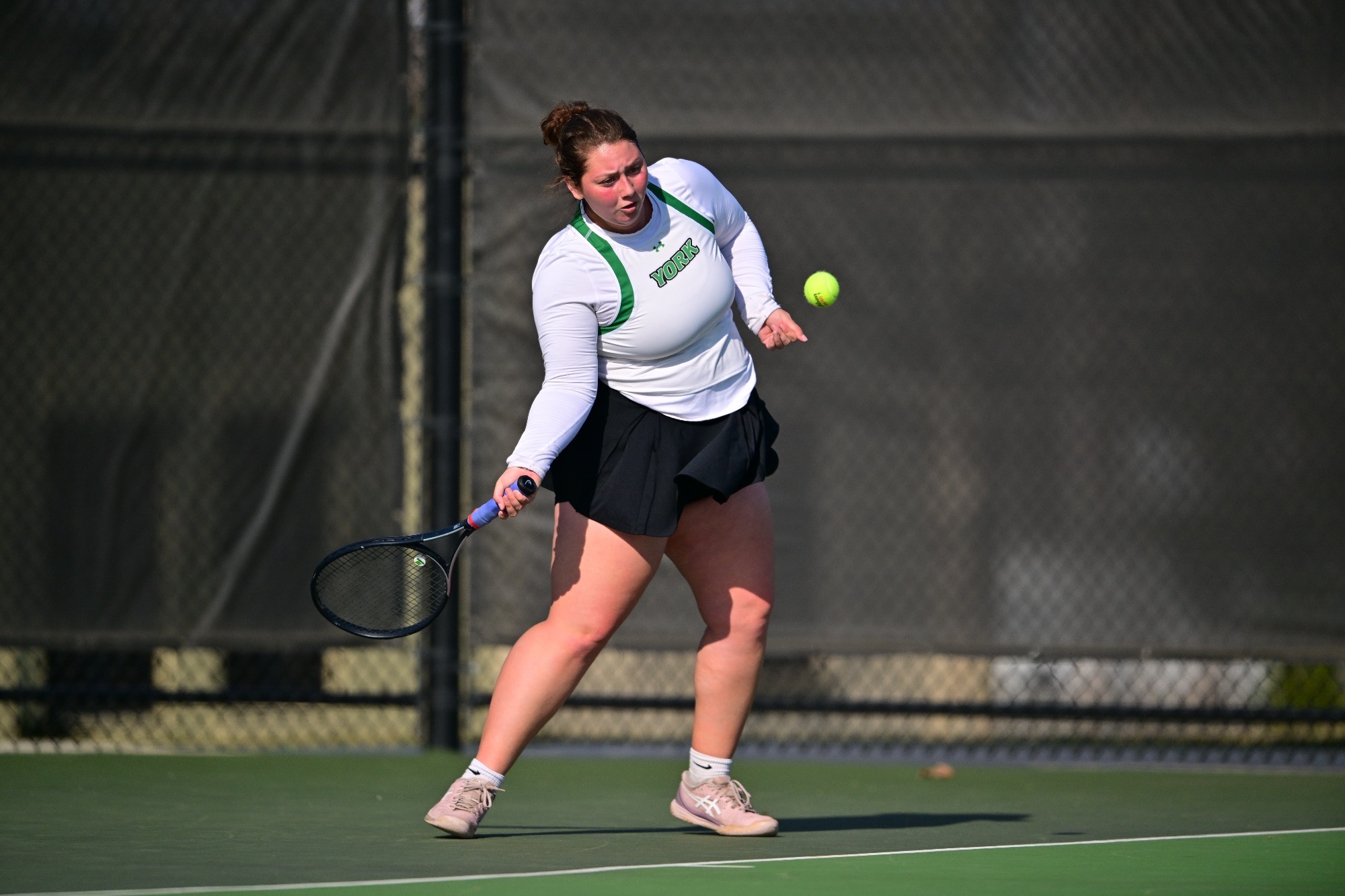 female with tennis racket