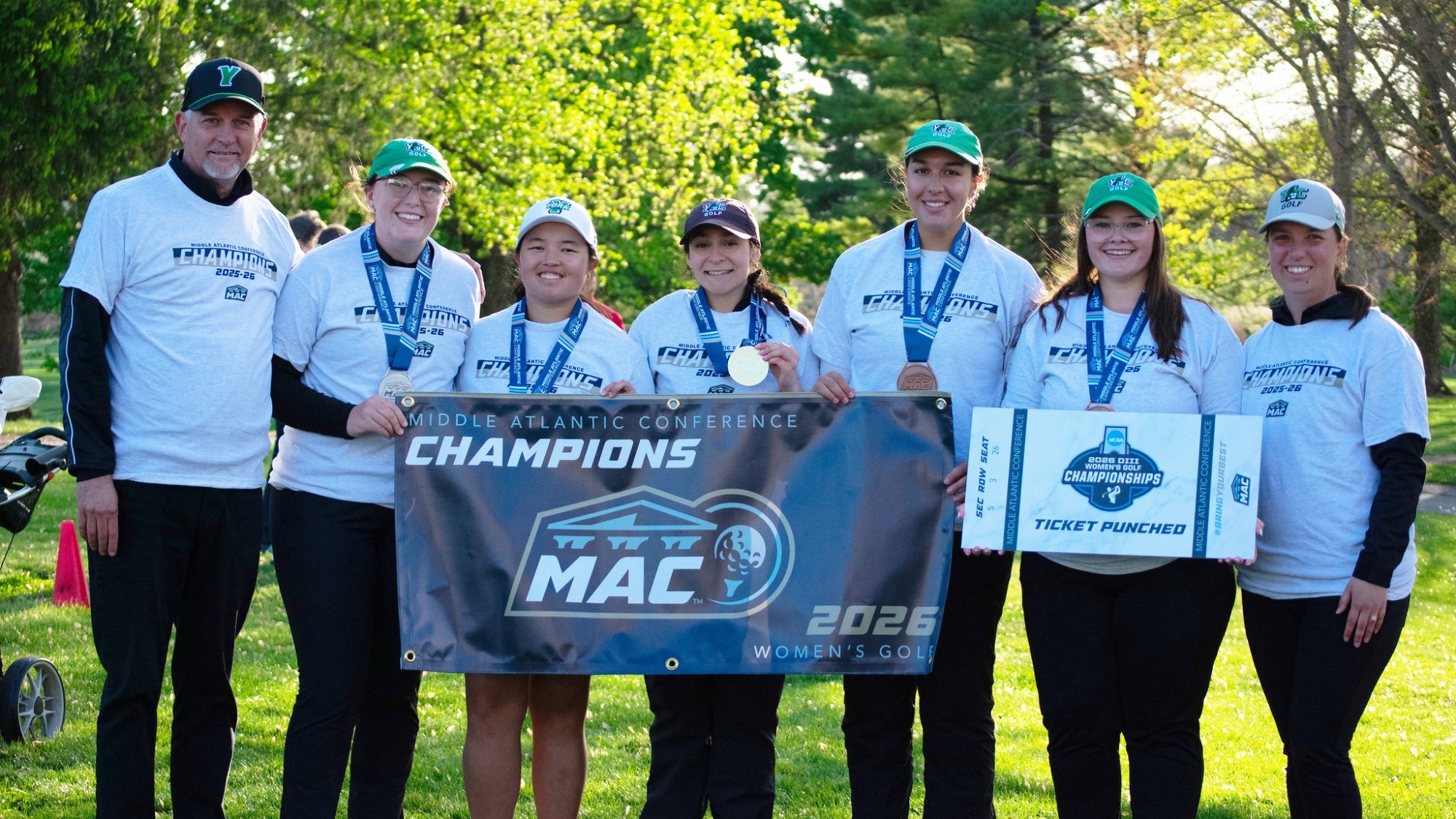 women's golf team posses for championship photo