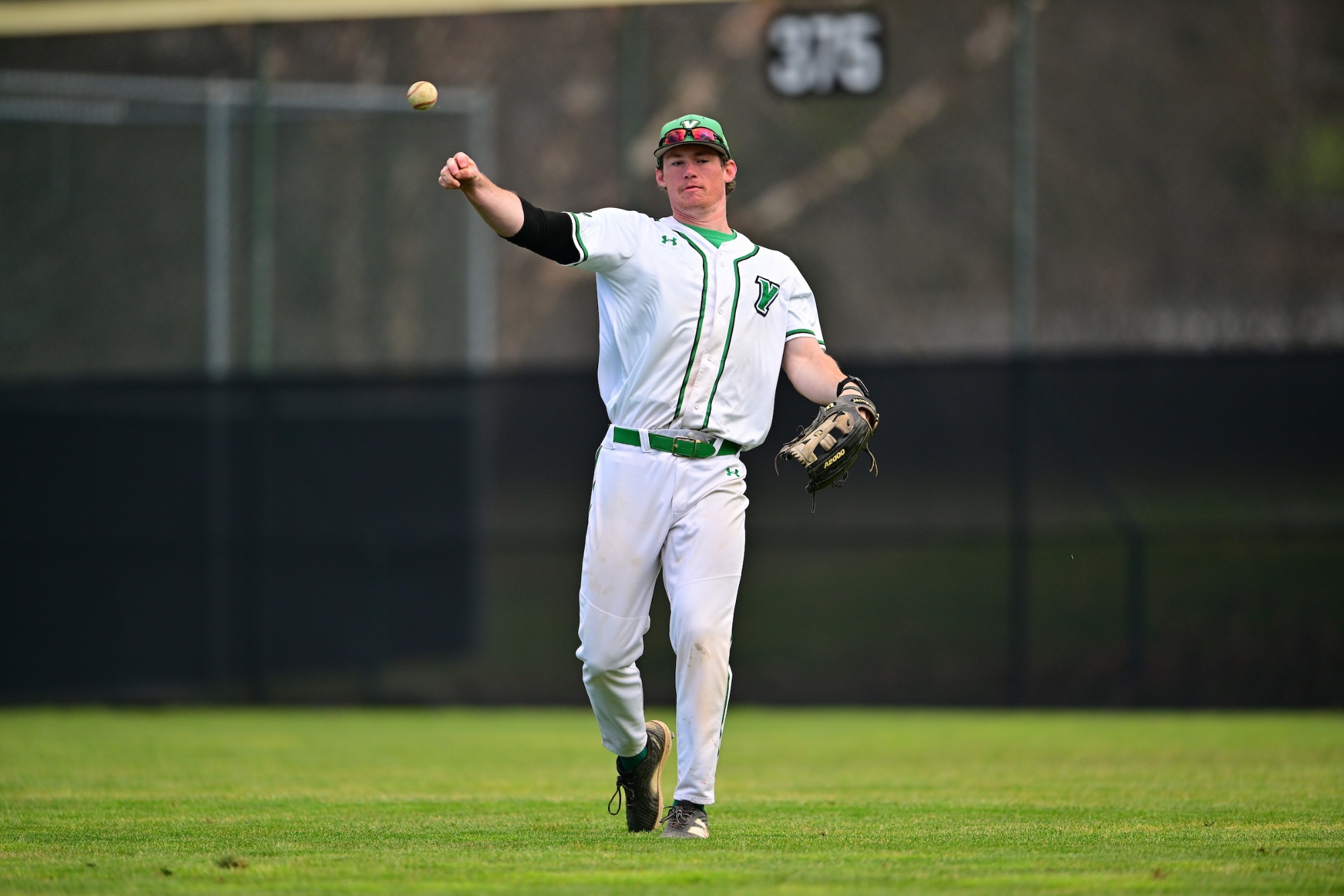 male throwing baseball