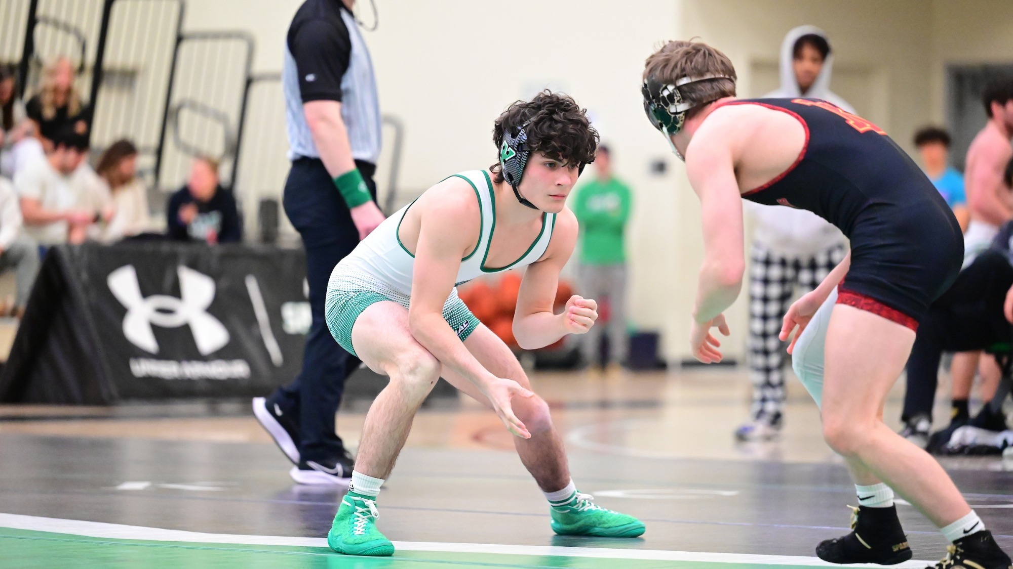 men's wrestler stalks opponent in home dual at Wolf Gym