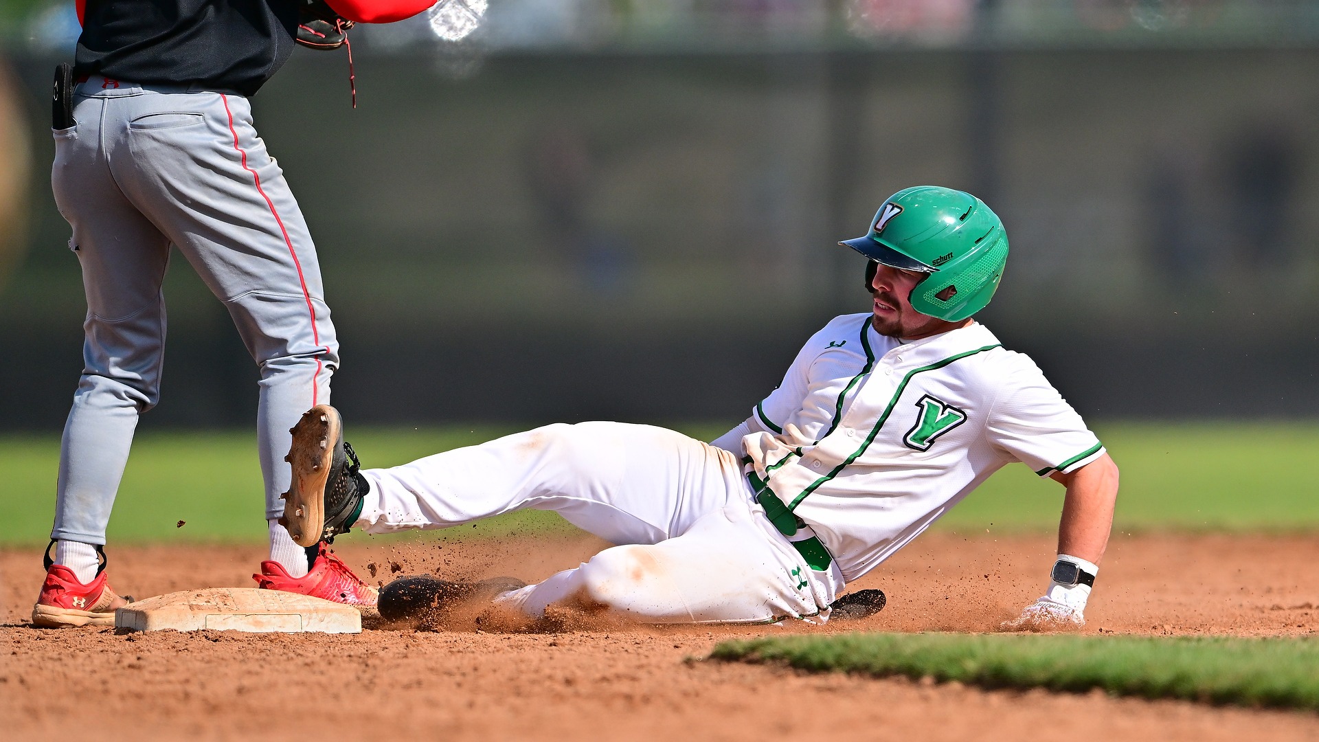 baseball player slides into second base at Jaquet Field