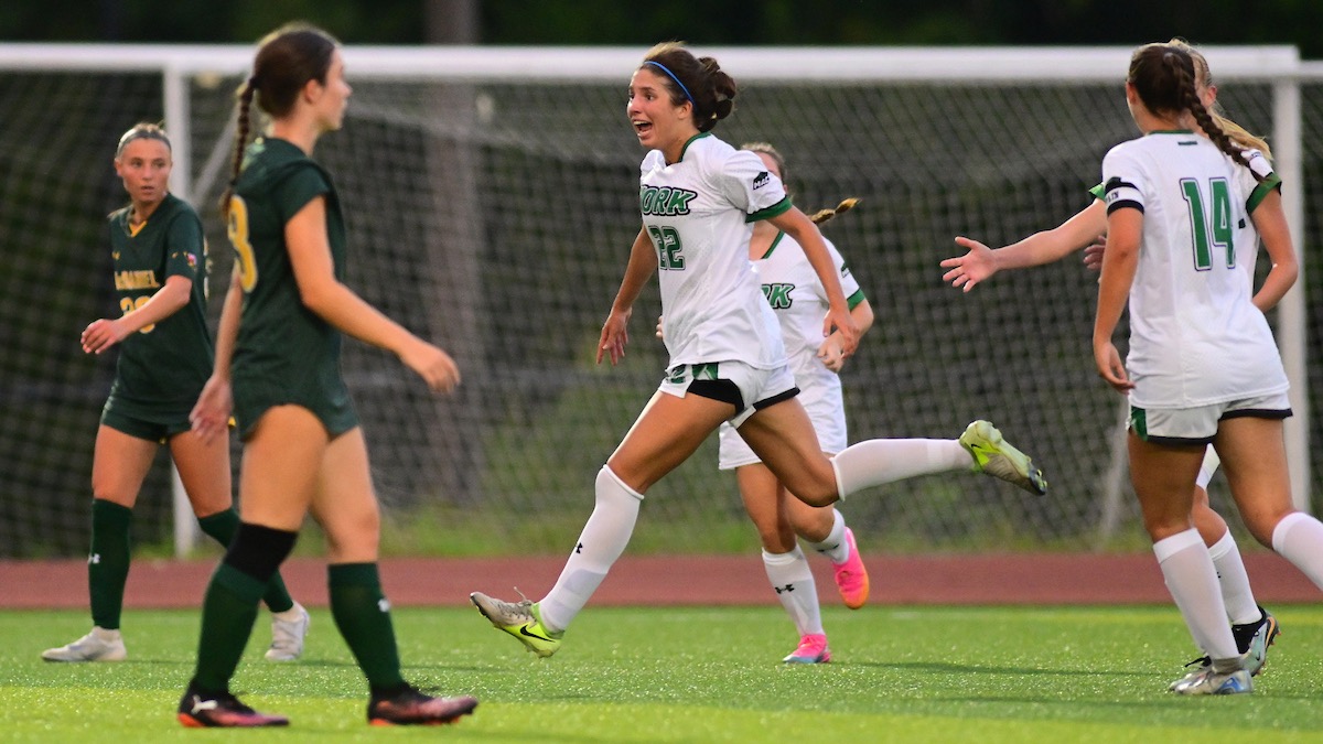 Female soccer player celebrating goal