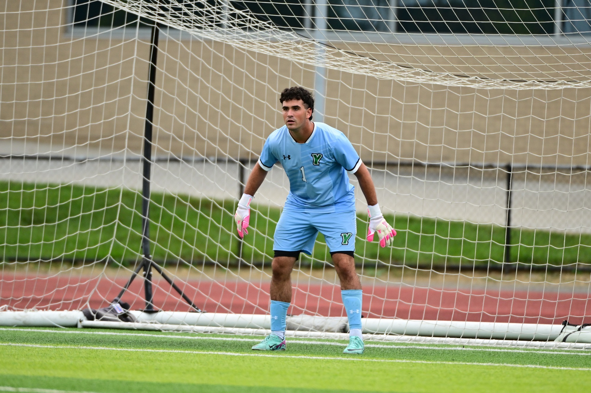 Male in goal for soccer with blue jersey