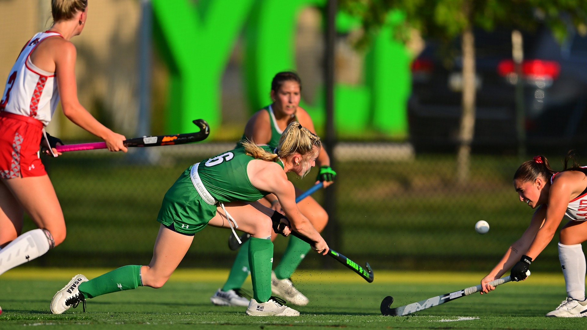 York female field hockey player scores a goal in game against Cortland