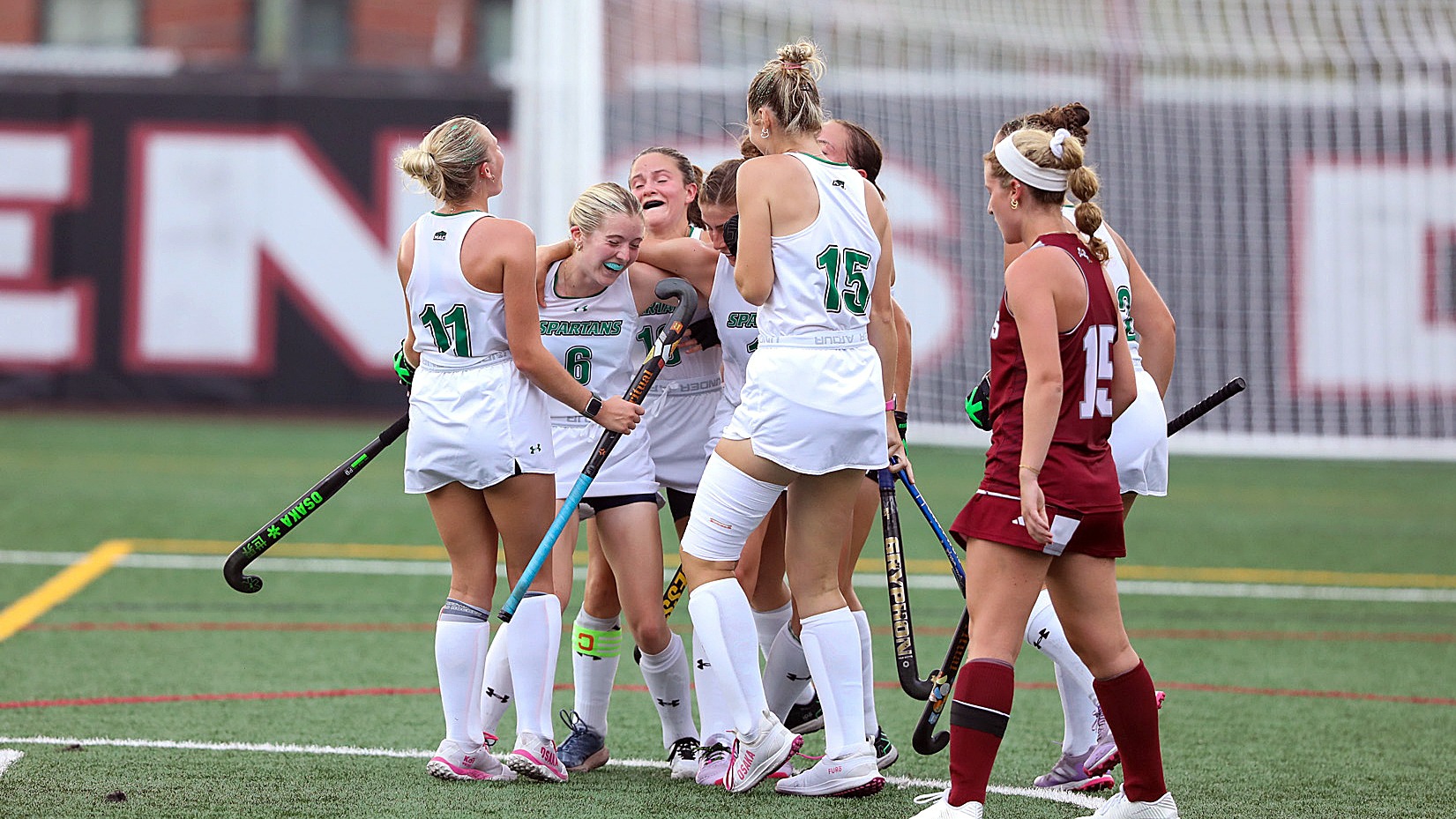 York field hockey players celebrate a goal at Stevens