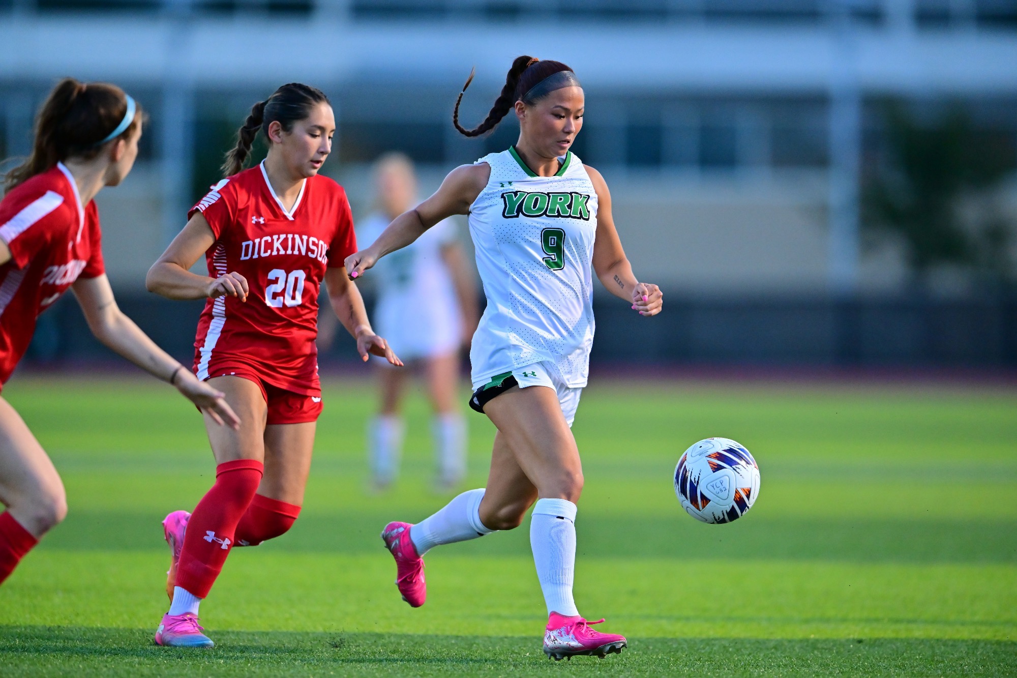 female dribbling soccer ball