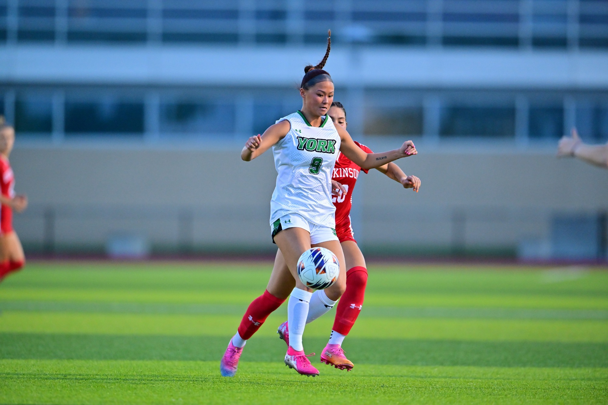 female controlling soccer ball