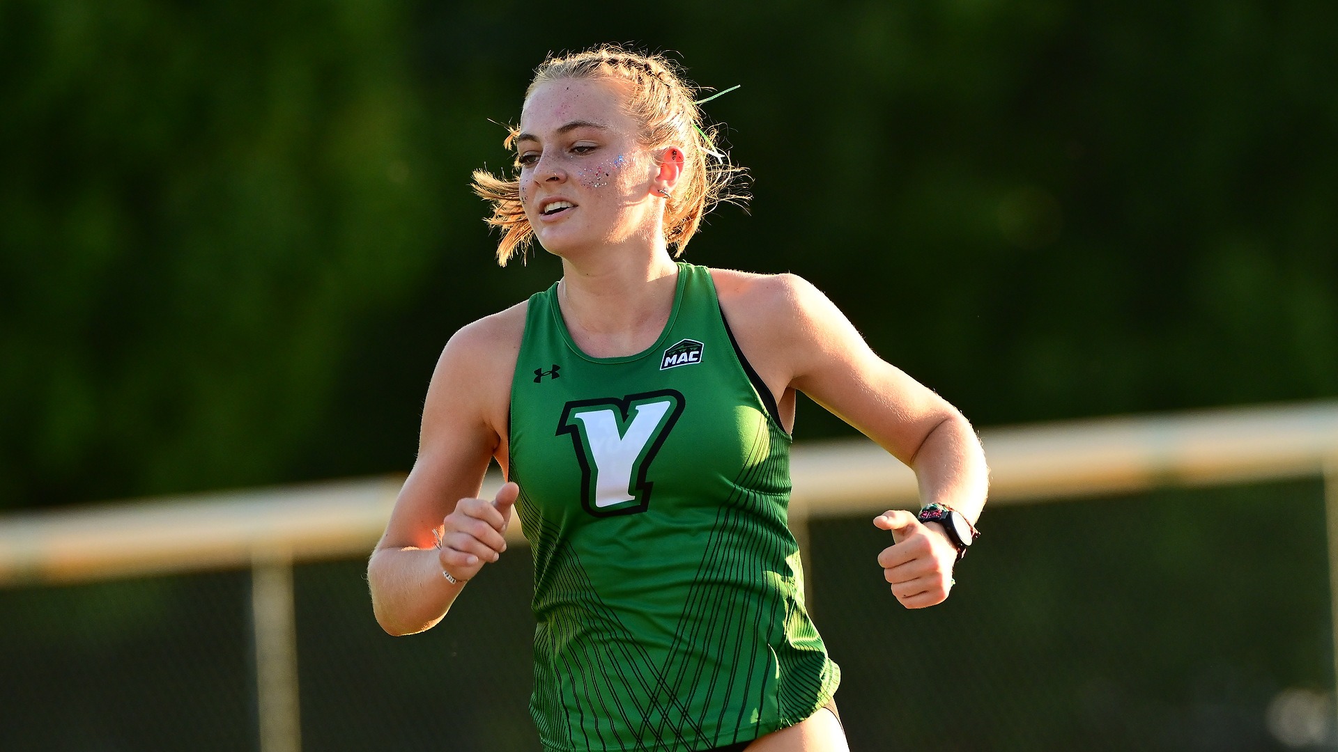 female cross country runner glides around the course