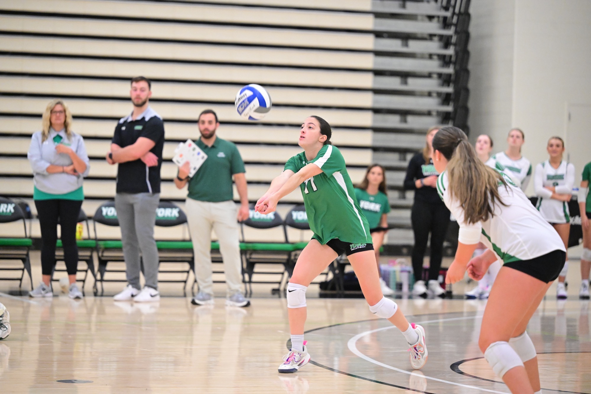 Female volleyball ball player receiving ball