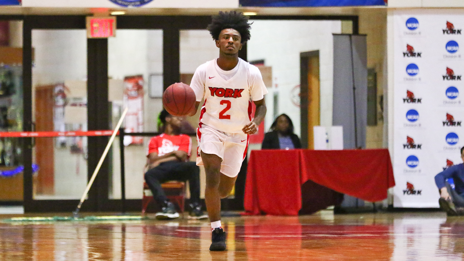 Men’s Basketball led by Chisholm’s 17point seasonopening effort