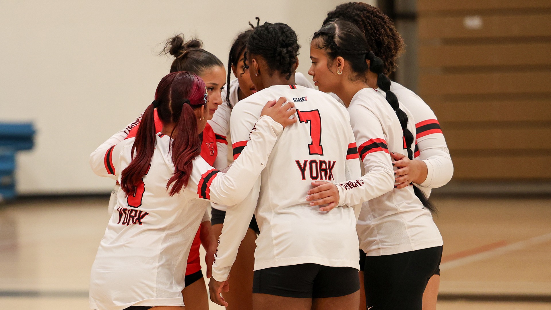 York College Women's Volleyball team huddles vs. Medgar Evers College (9.15.2026)