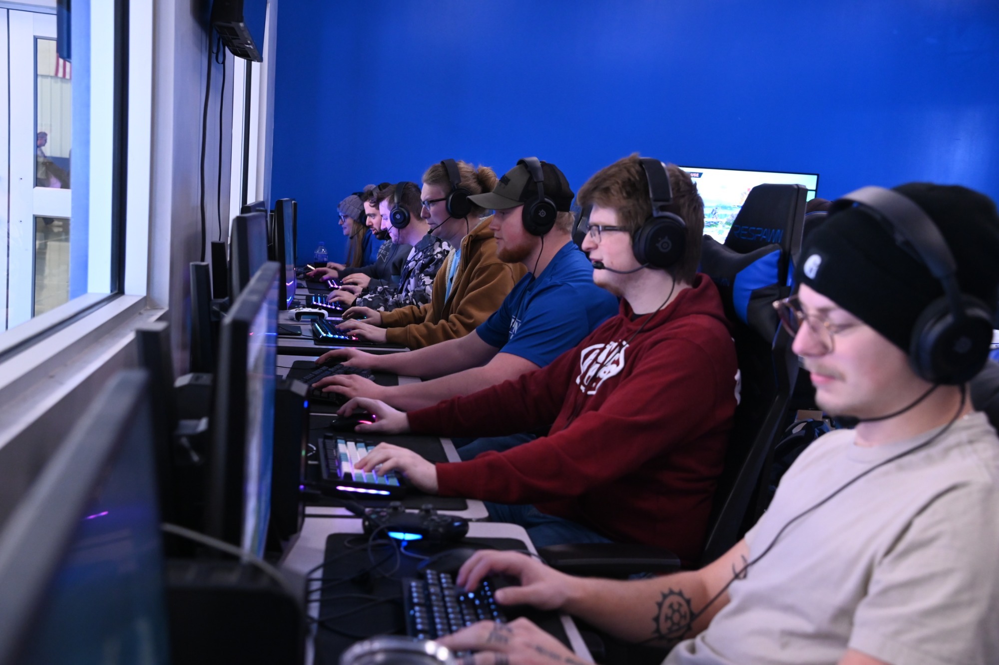 Esports players competing in their room