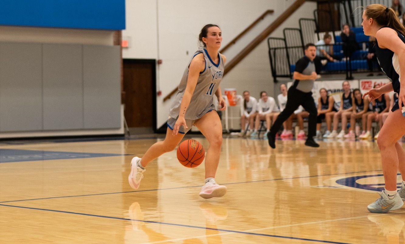 Shepherd dribbles the court